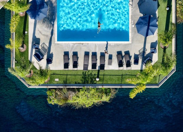 A swimmer works out in the lake-side pool at East Lake Village in Yorba Linda in August. (Photo by Jeff Gritchen, Orange County Register/SCNG)