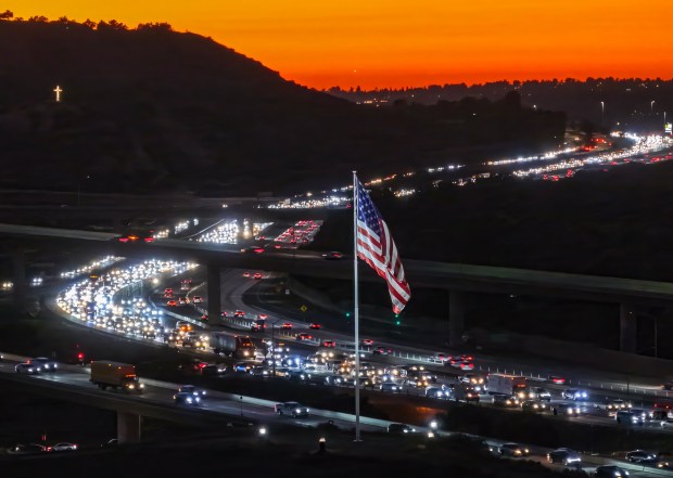 A 60-foot by 30-foot U.S. Flag flies from a 100-foot pole along the 91 Freeway at Gypsum Canyon in Anaheim Hills in October. Nicknamed "Flag One," it was raised in November 2022 on at the future site of the Orange County Veterans Memorial Cemetery. (Photo by Jeff Gritchen, Orange County Register/SCNG)