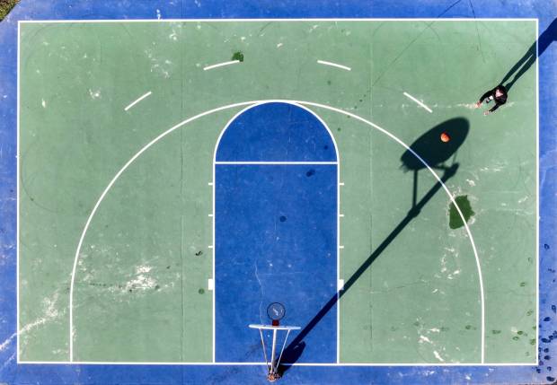 A man shoots hoops on a beach-side half court at Main Beach in Laguna Beach in October. (Photo by Jeff Gritchen, Orange County Register/SCNG)