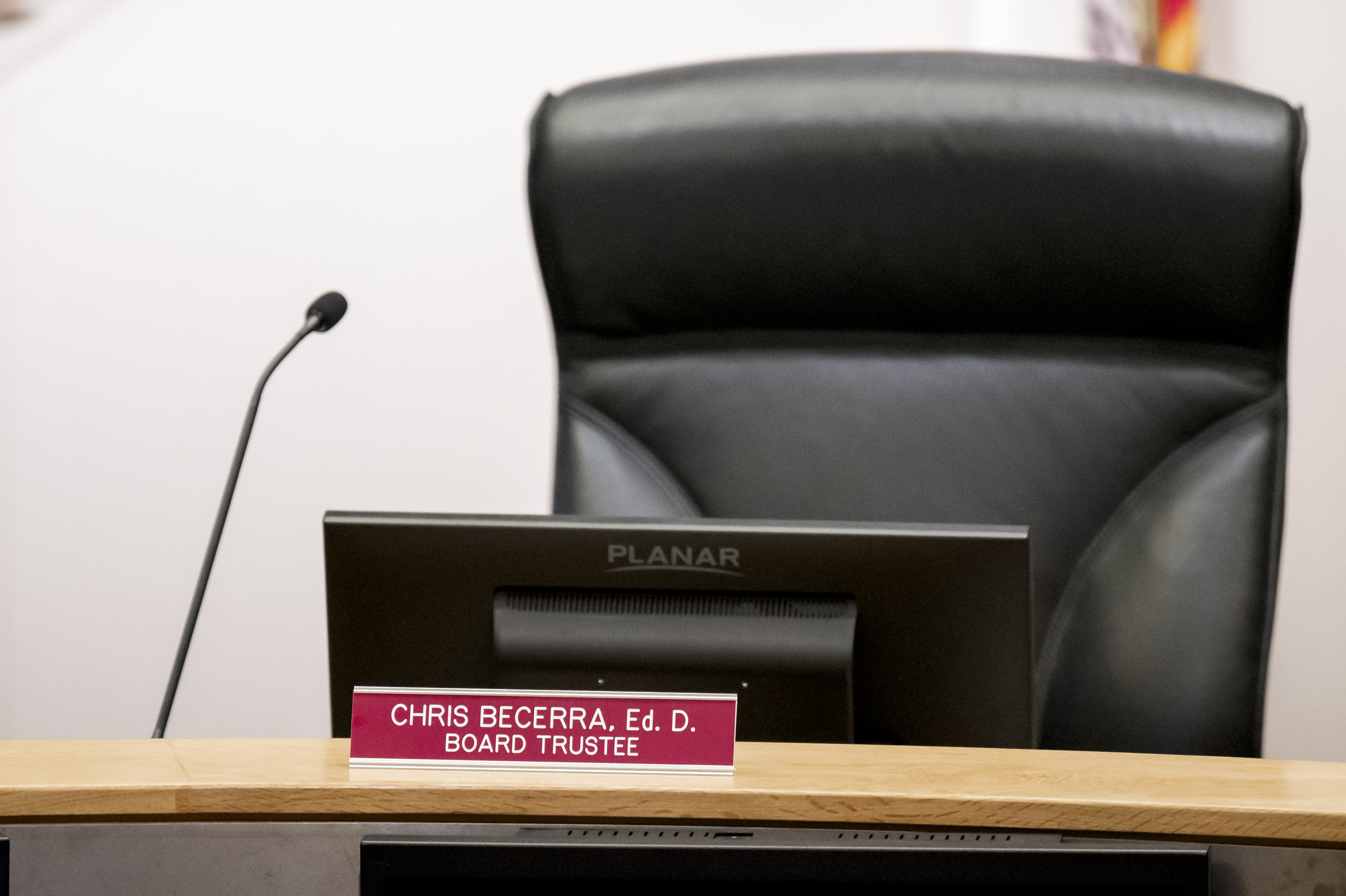 The empty chair of Trustee Christopher Becerra during a Brea...