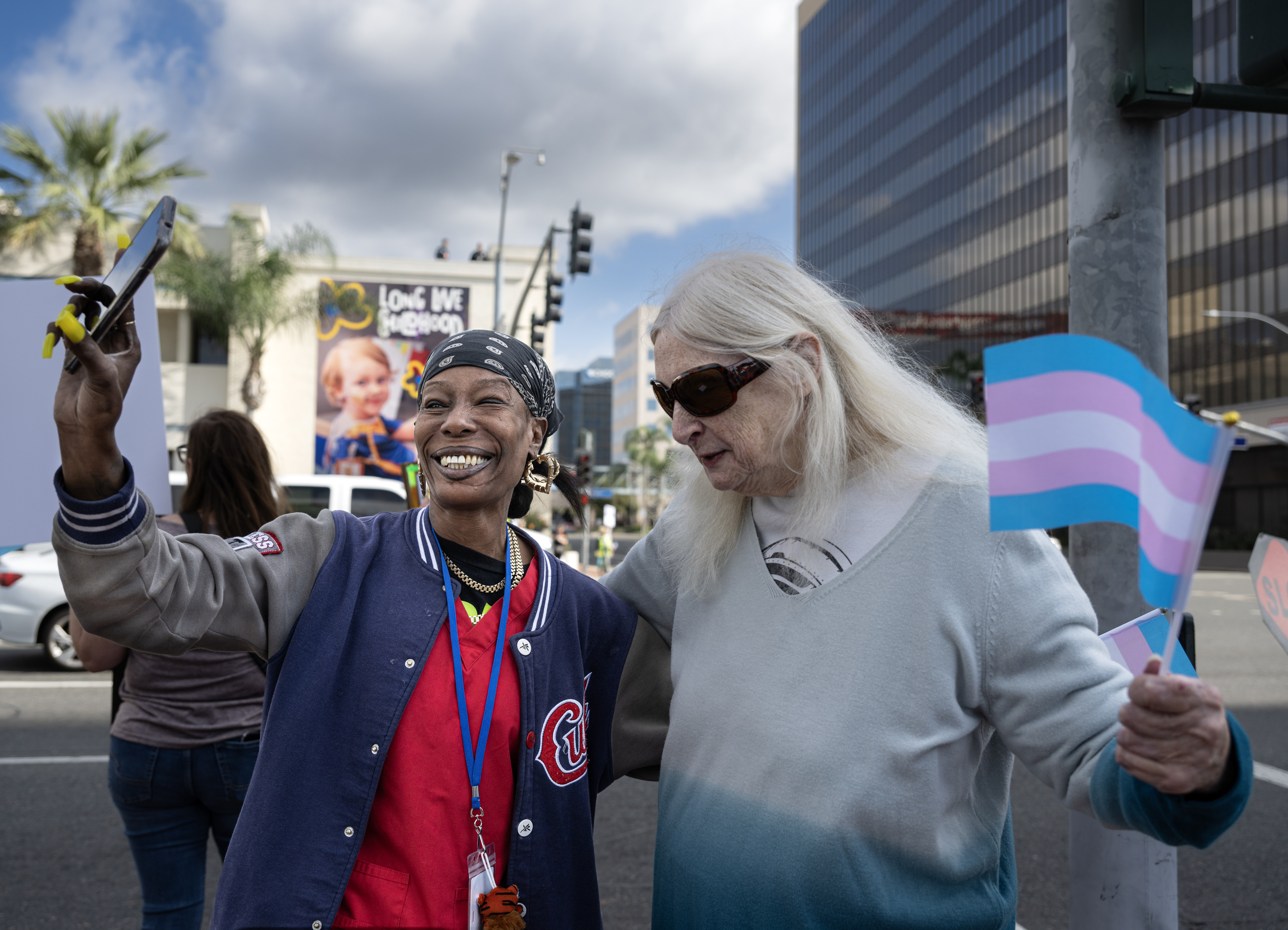 Shermaine Newman, left, and Cherie Rabideau, record themselves while demonstrating...