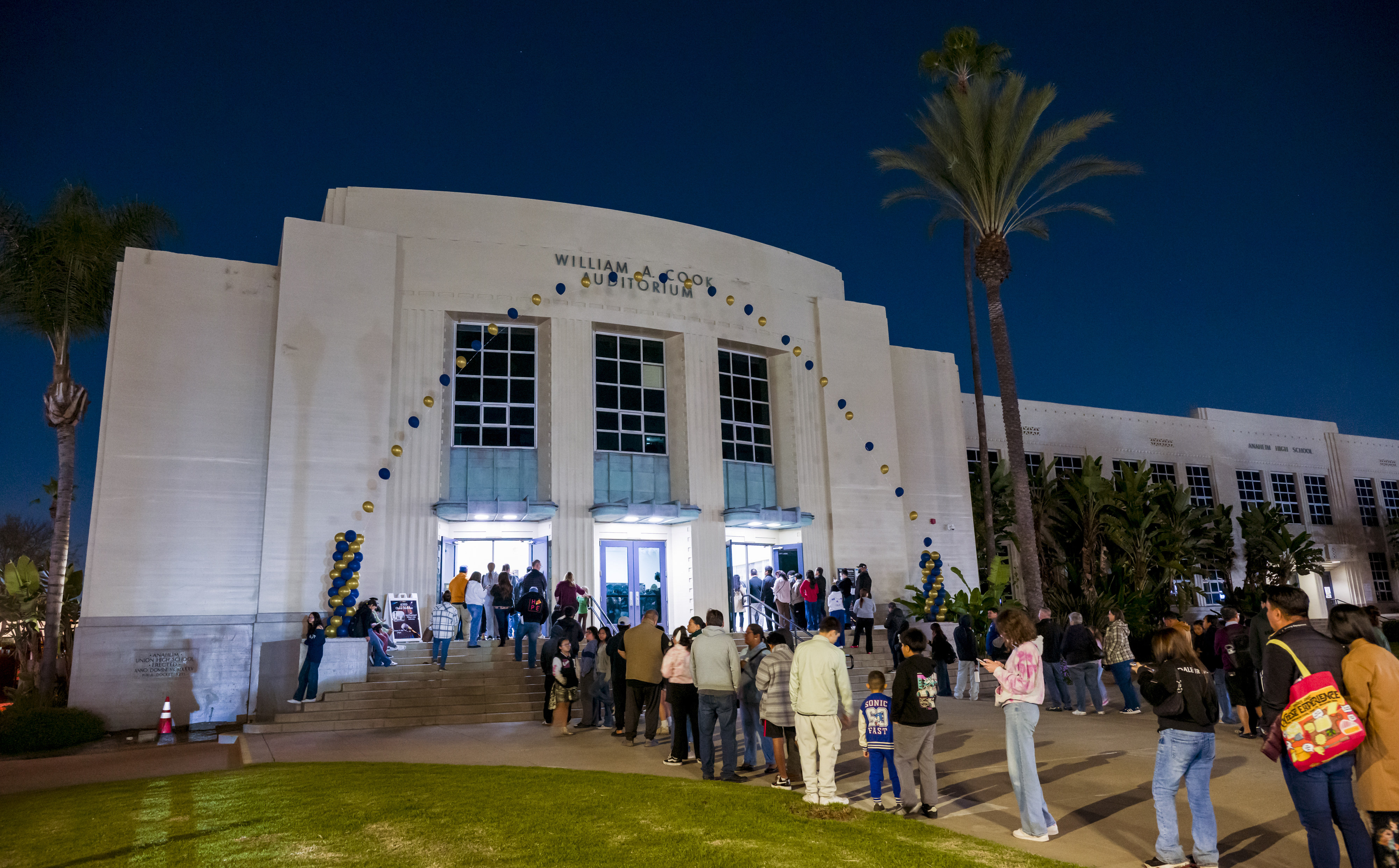 Parents and students line up to enter the historic William...