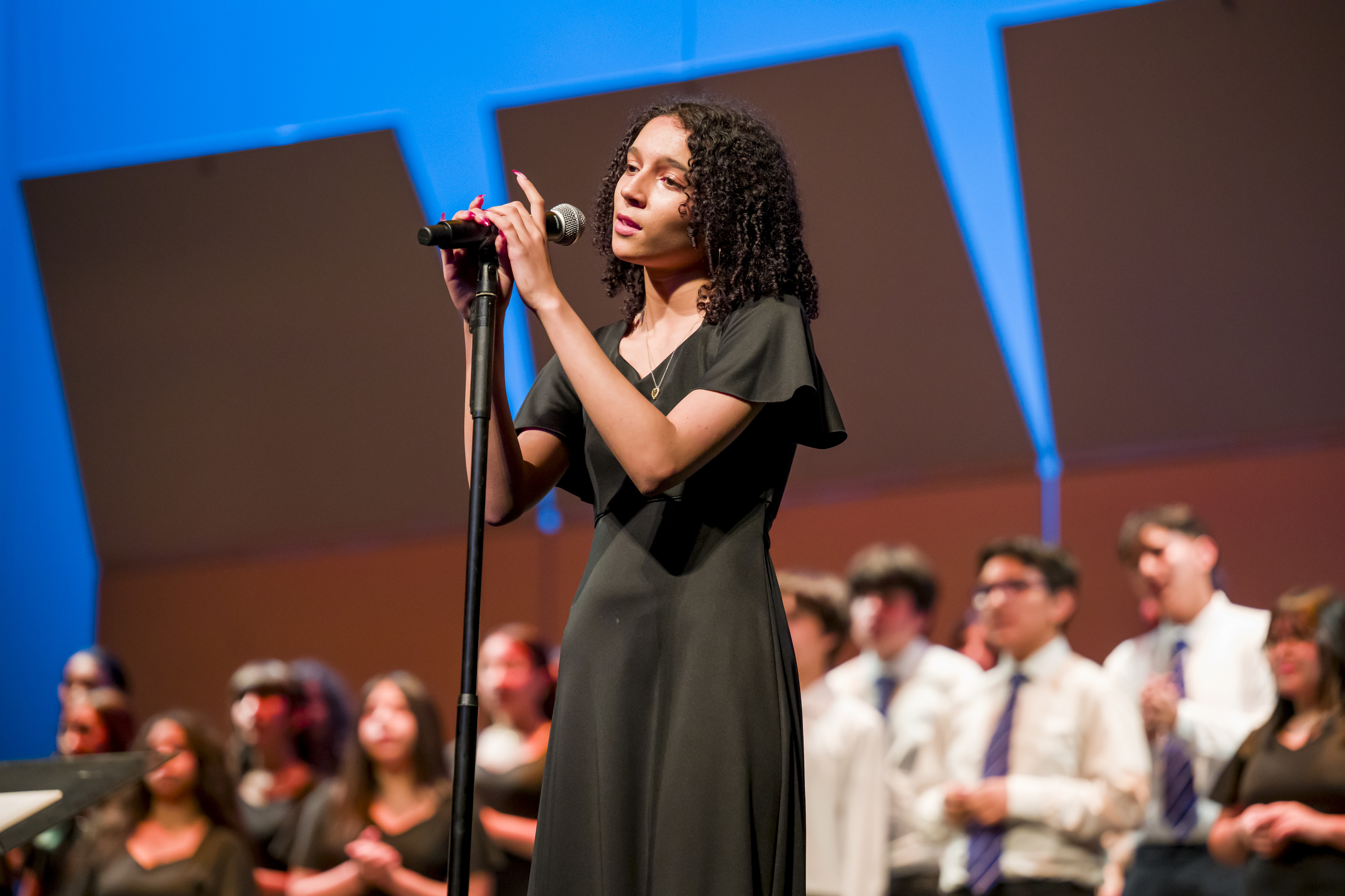 Kaitlyn Givens sings âStandUpâ with the Western High School Pioneer...