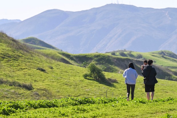 A family carries their child while checking out a look out point in Chino Hills State Park on Thursday, March 20, 2025. (Photo by Anjali Sharif-Paul, The Sun/SCNG)