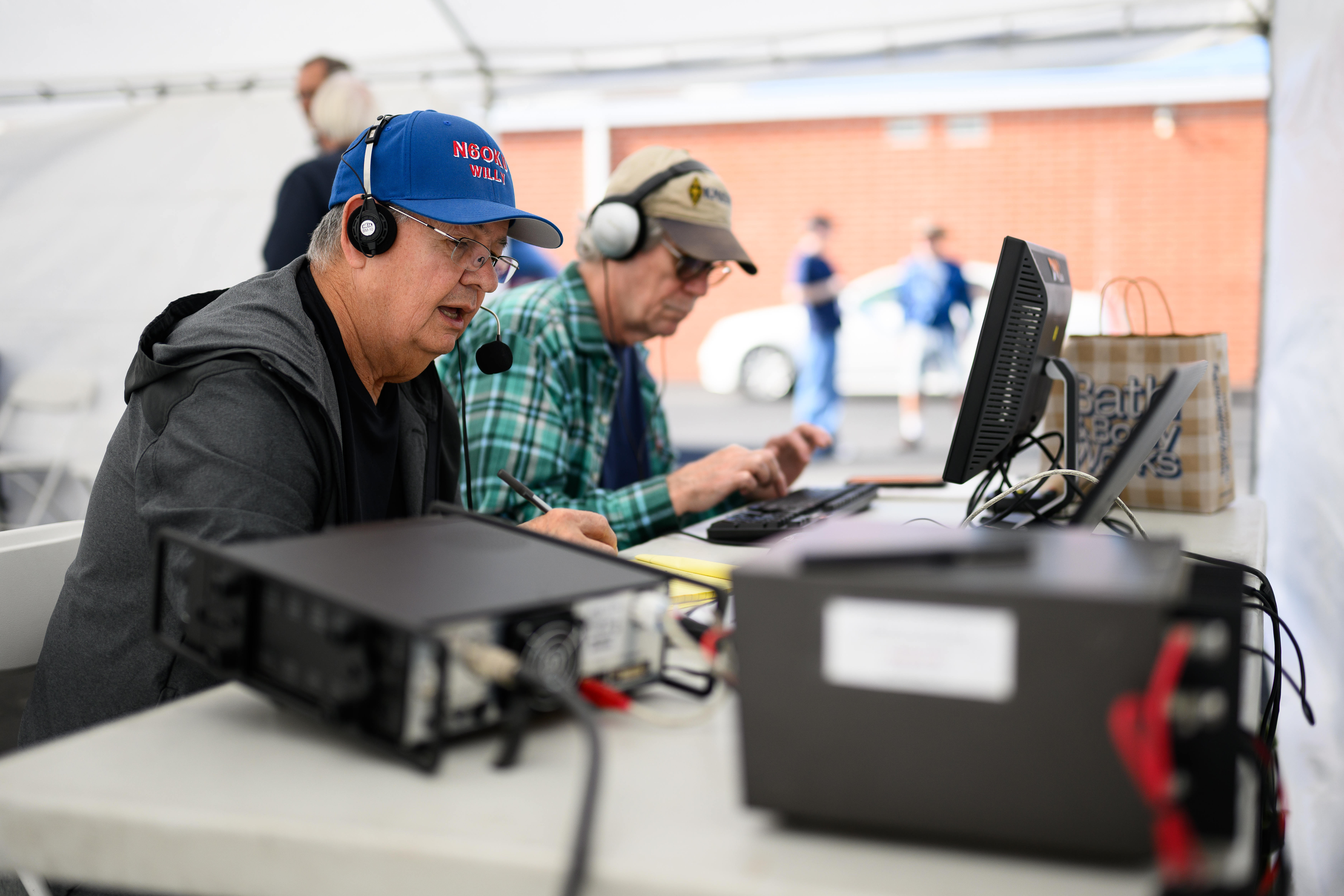 Willy Bustamante operates a radio for the Orange County Amateur...