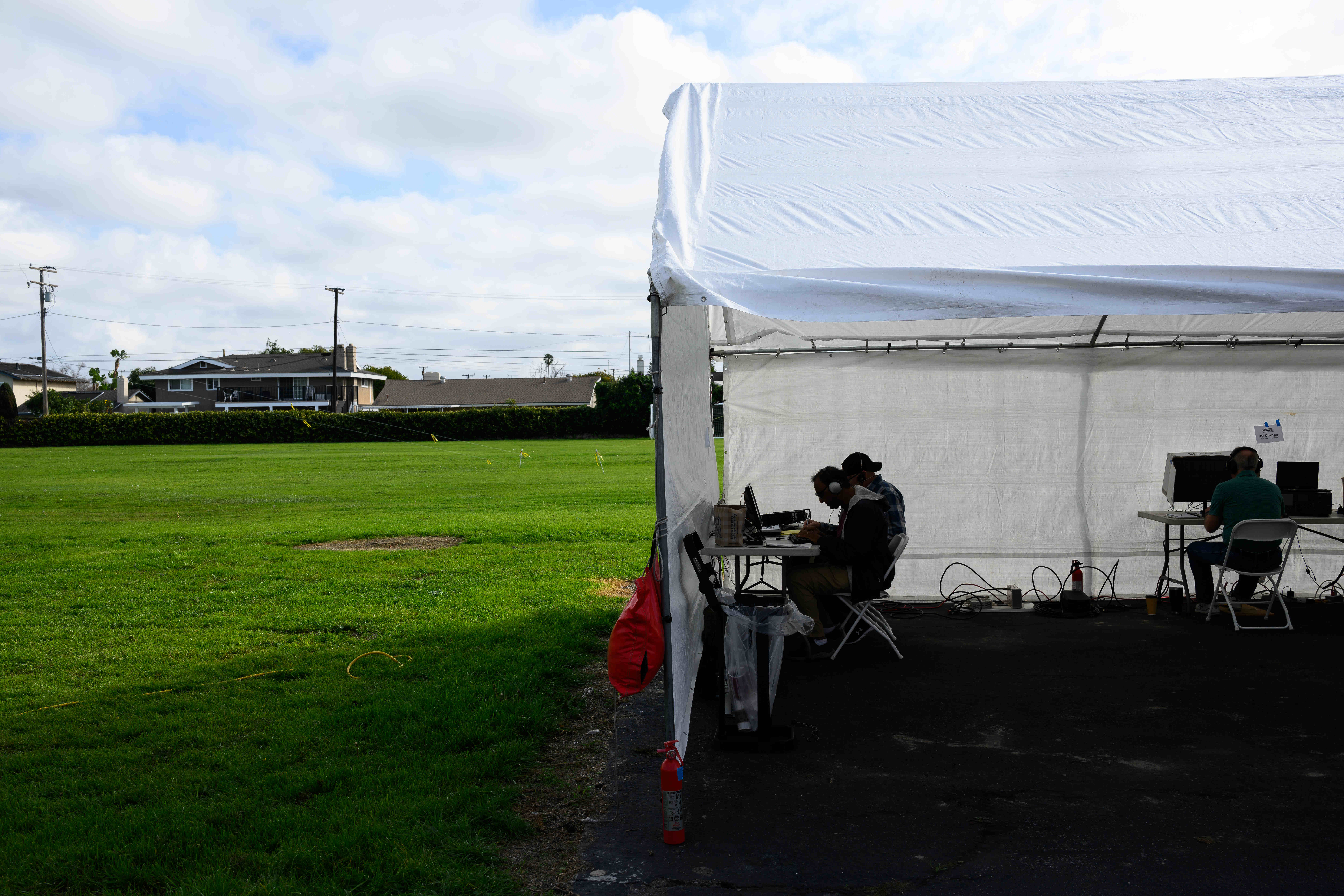 Members of the Orange County Amateur Radio Club work to...