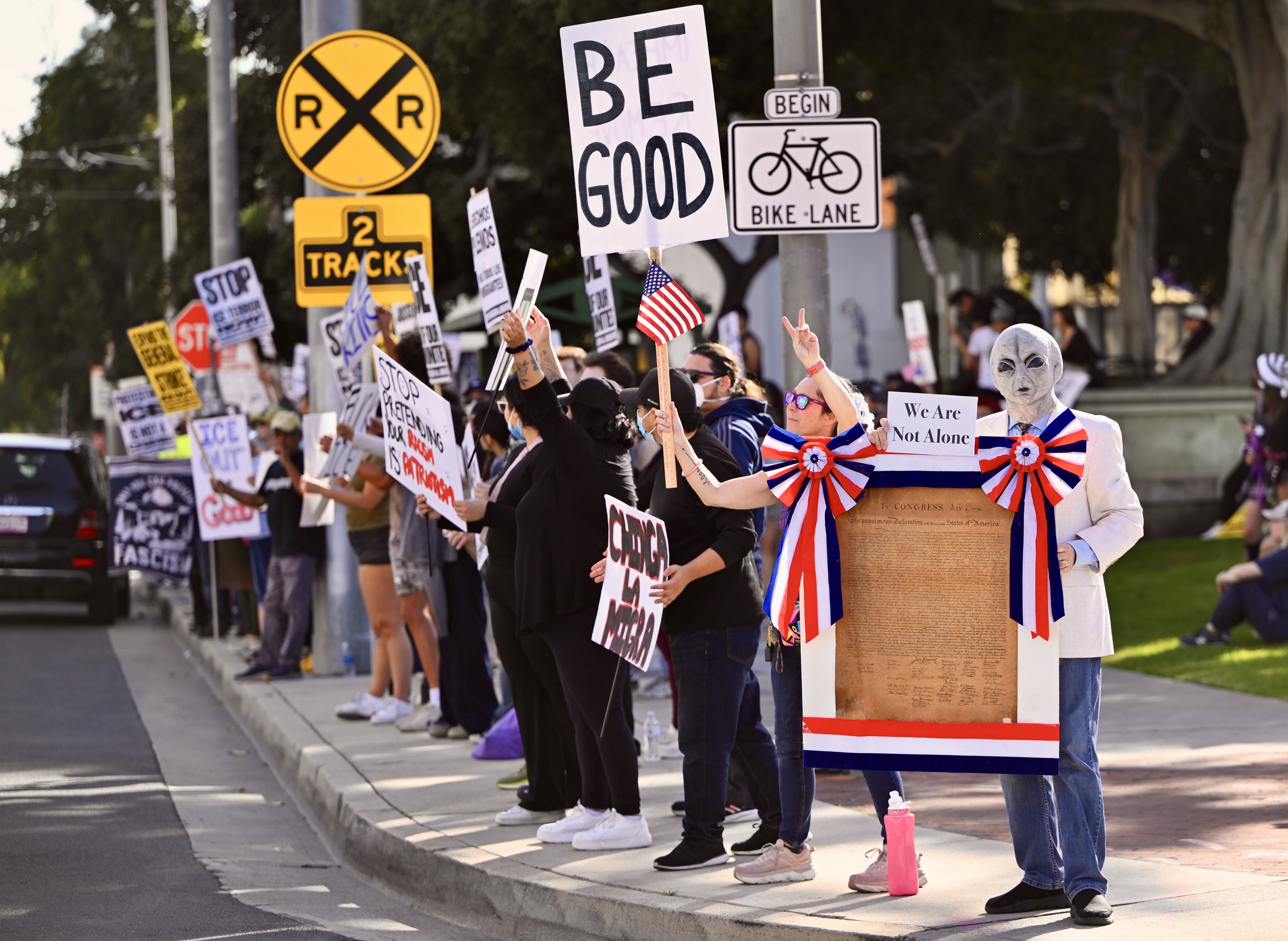 Protesters line Ross Street during a demonstration against ICE in...