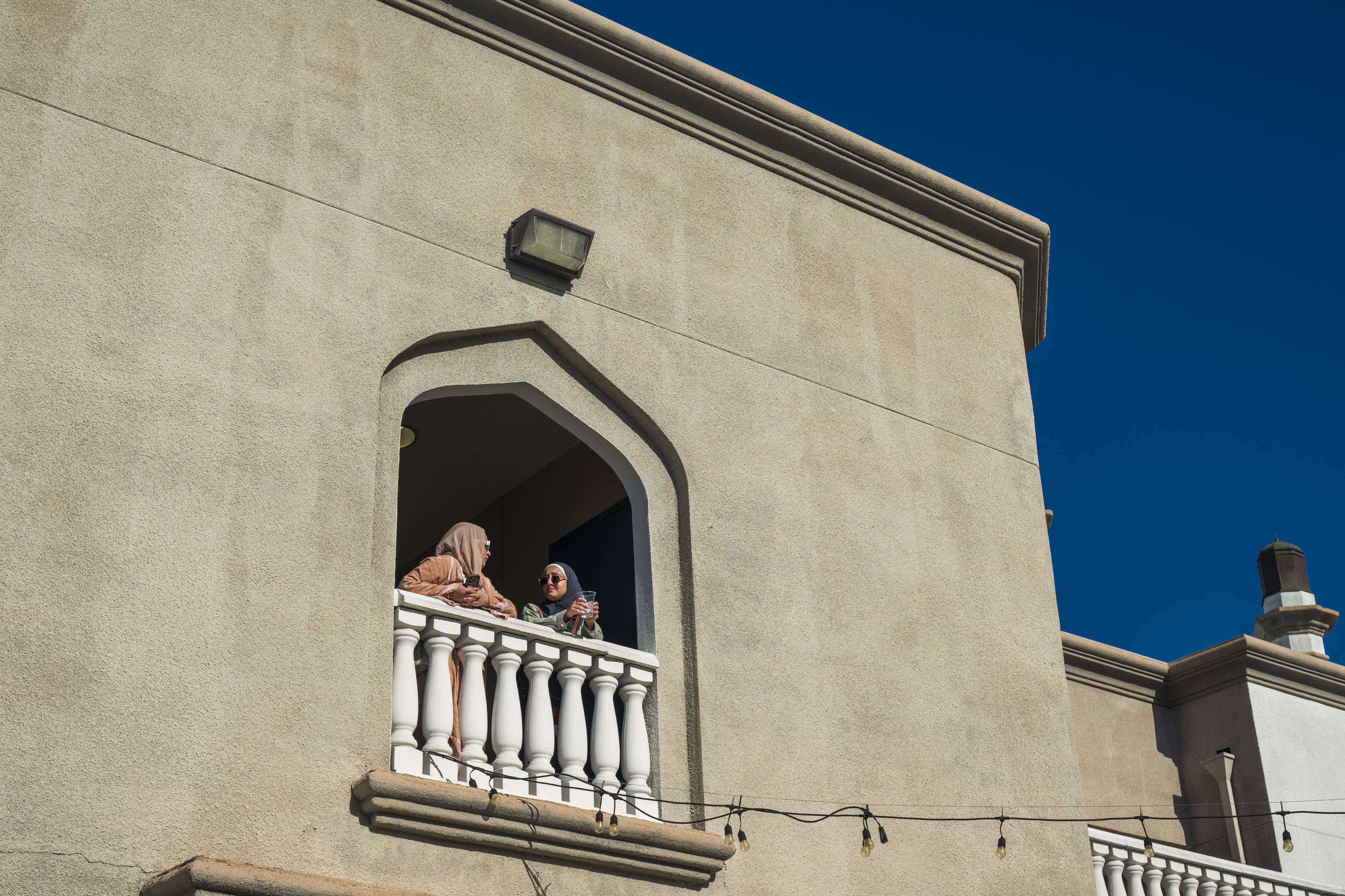 Women chat on the second level of the Islamic Society...