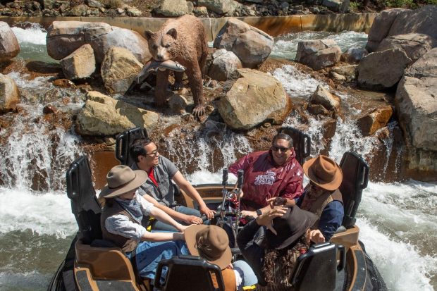 An animatronic bear looms above members of the media and several Ghost Town Alive performers on the new Calico River Rapids water ride at Knott's Berry Farm in Buena Park on Thursday, May 16, 2019. (Photo by Kevin Sullivan, Orange County Register/SCNG)