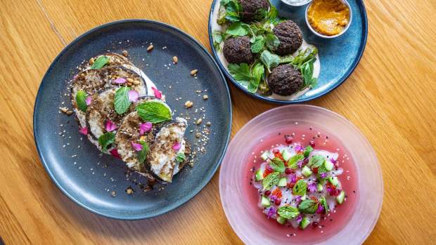 Dishes at Mayfield in San Juan Capistrano, from left: eggplant toast with eggplant, confit garlic labneh and pistachio dukkah grilled seeded sourdough; Falafel with shishito peppers, tahini, amba and tzatziki; Crudo with striped bass sashimi, citrus and pomegranate, cucumber, sesame seeds and pickled fresno, on Wednesday, March 8, 2023. (Photo by Mark Rightmire, Orange County Register/SCNG)