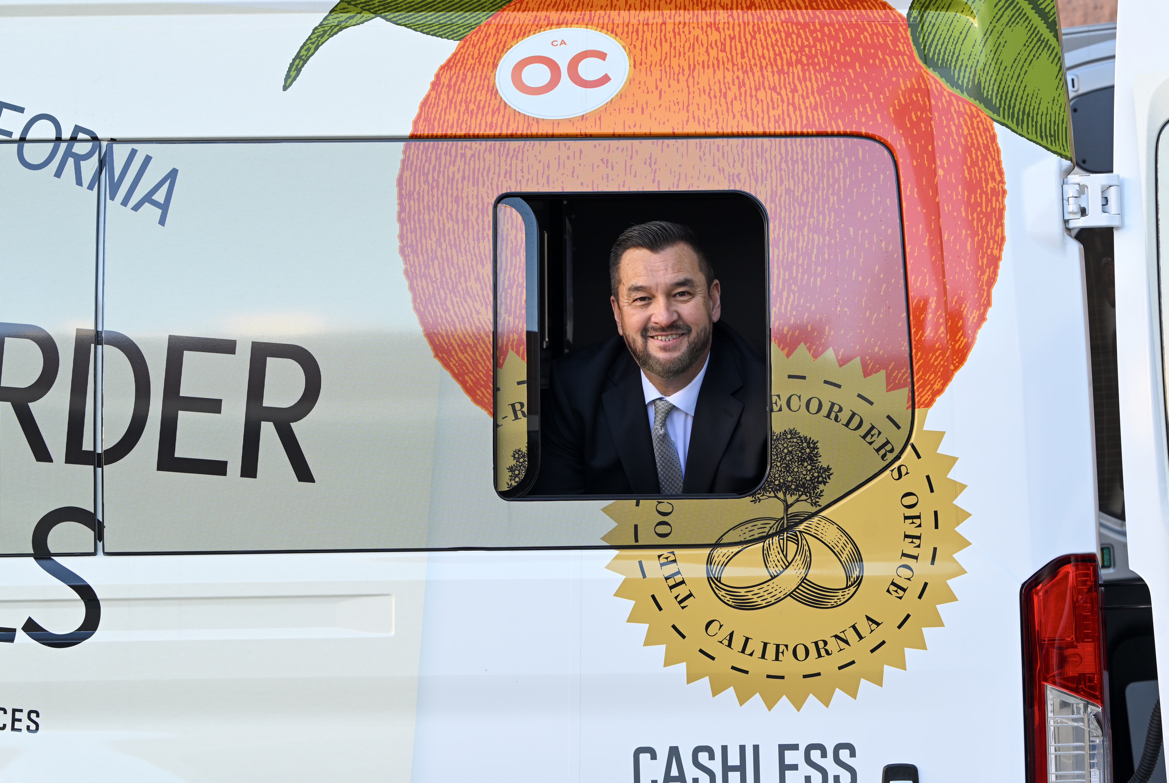 Orange County Clerk-Recorder Hugh Nguyen insdie thier new mobile van...