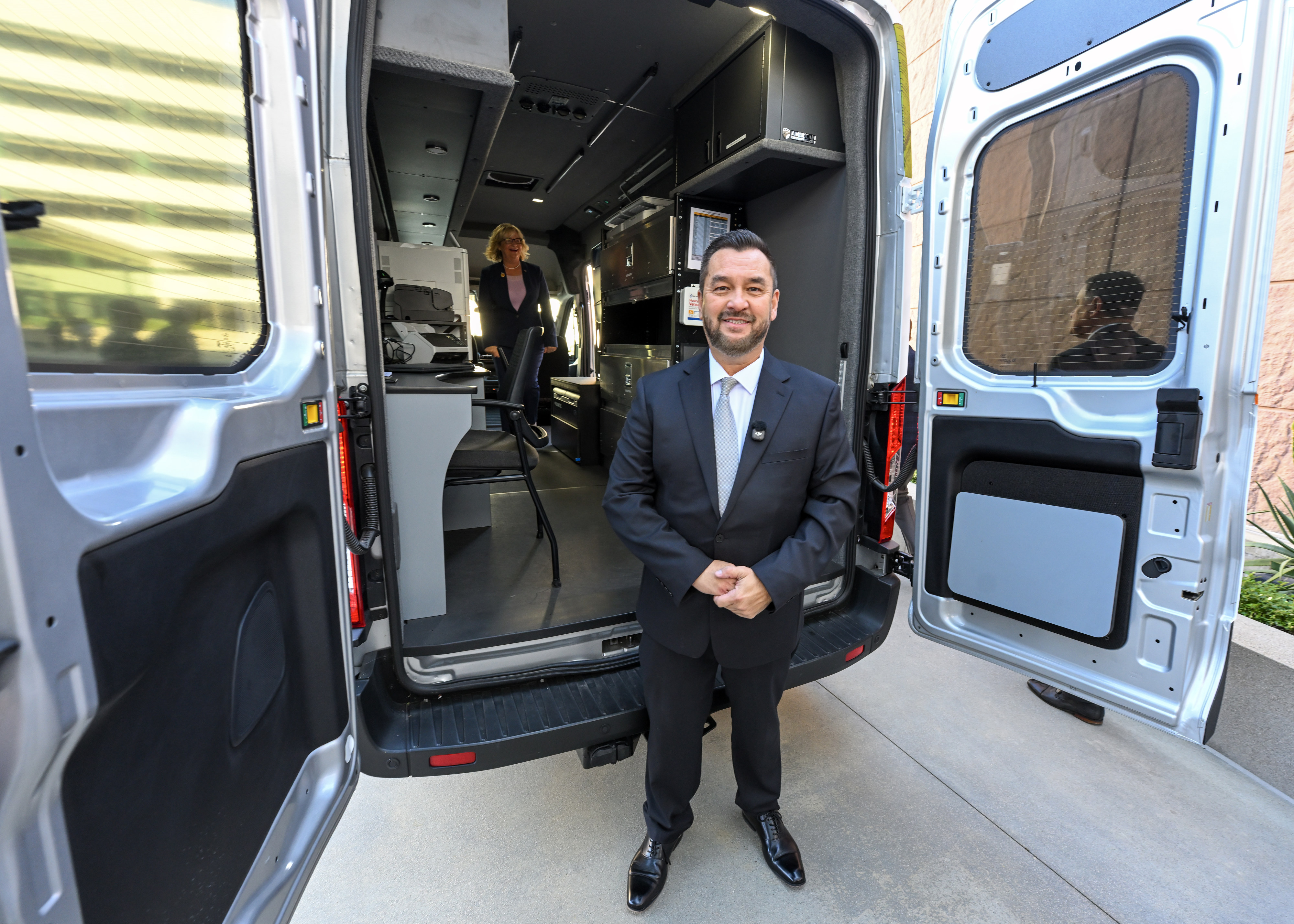 Orange County Clerk-Recorder Hugh Nguyen with thier new mobile van...