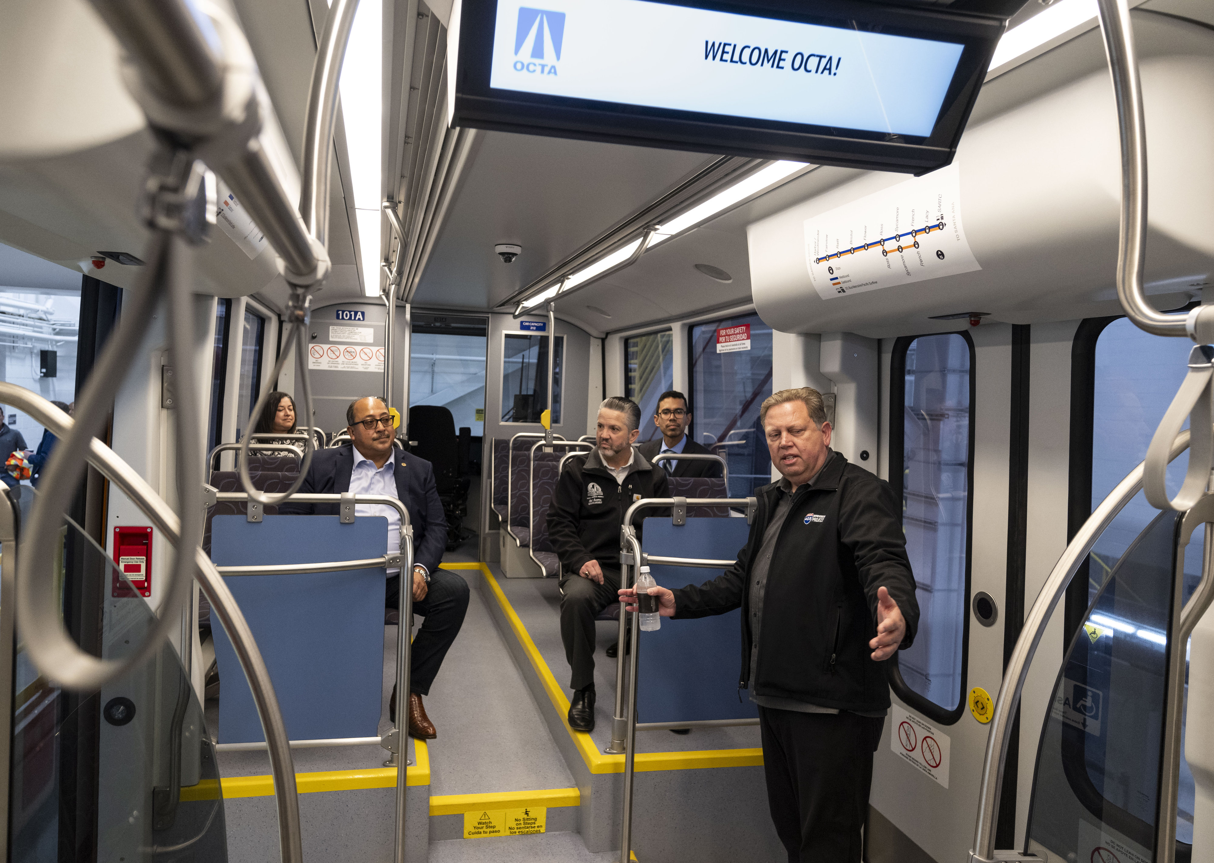 Orange County Transportation Authority CEO Darrell E. Johnson, right, talks...