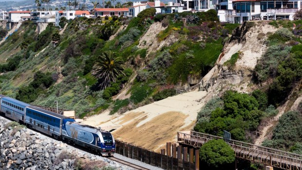 An Amtrak Pacific Surfliner train travels south through San Clemente, California, at Mariposa Point on March 25, 2024, following a nearly two-month closure due to landslides. (Paul Bersebach/SCNG)