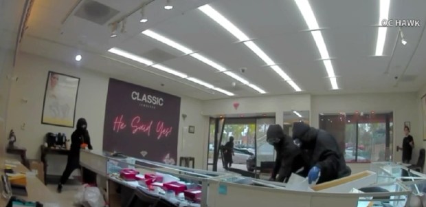 Robbers smash showcases and grab items at Classic Jewelers in Anaheim Hills on Jan. 23, 2026. (Surveillance photo)