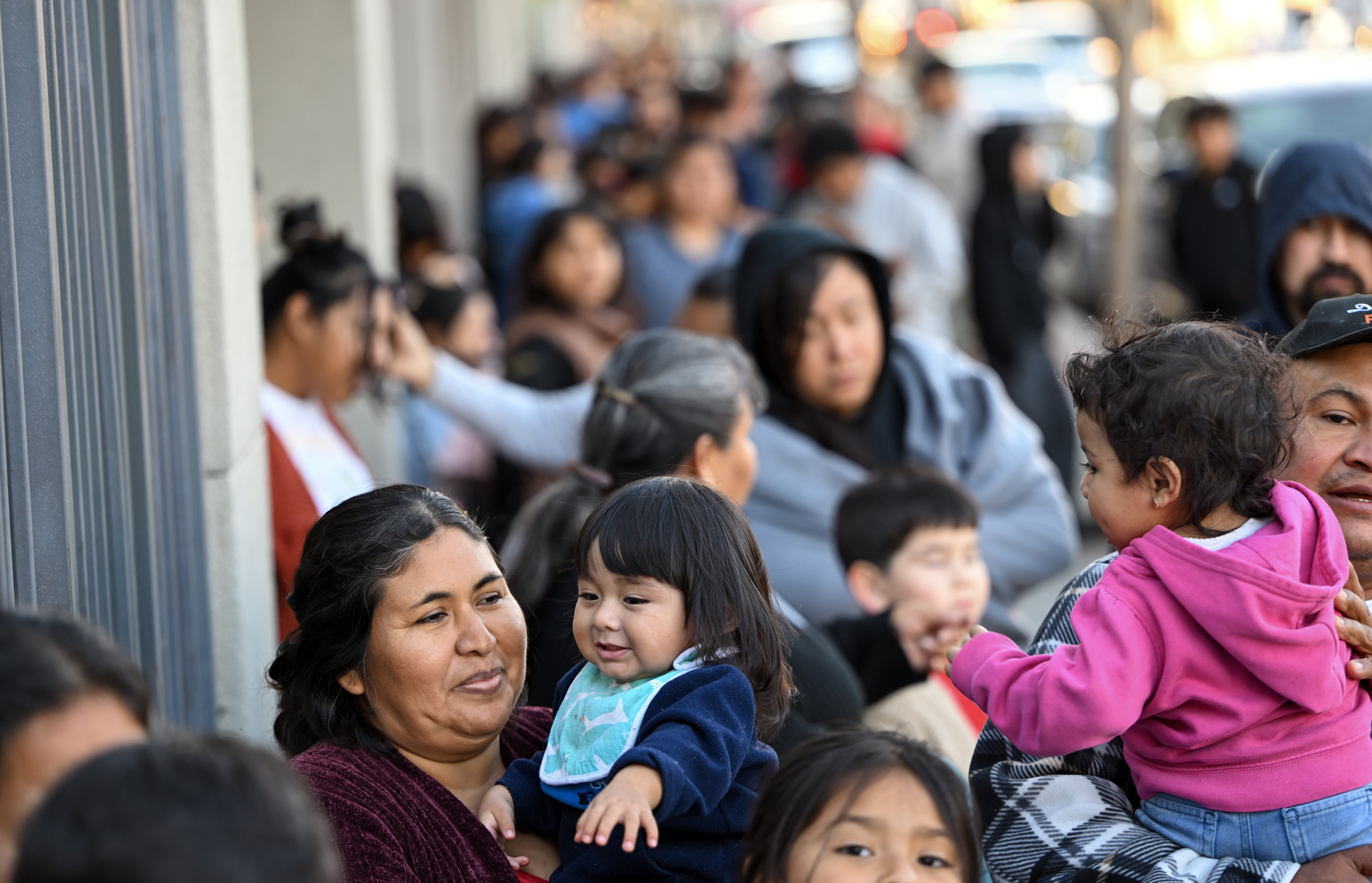 Beatrice Covarrubias holds her son, Nathan Salgado, 1, as they...