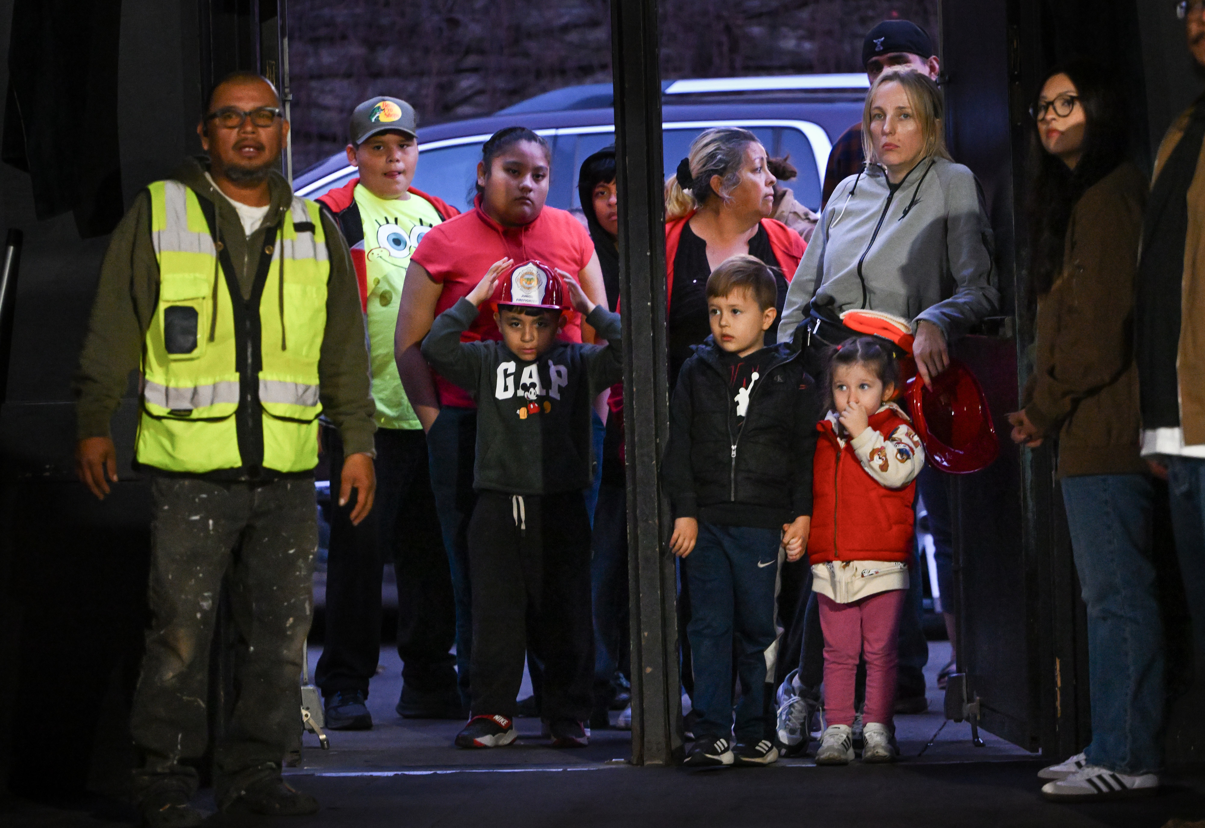Visitors wait to enter the annual Downtown Santa Ana Holiday...