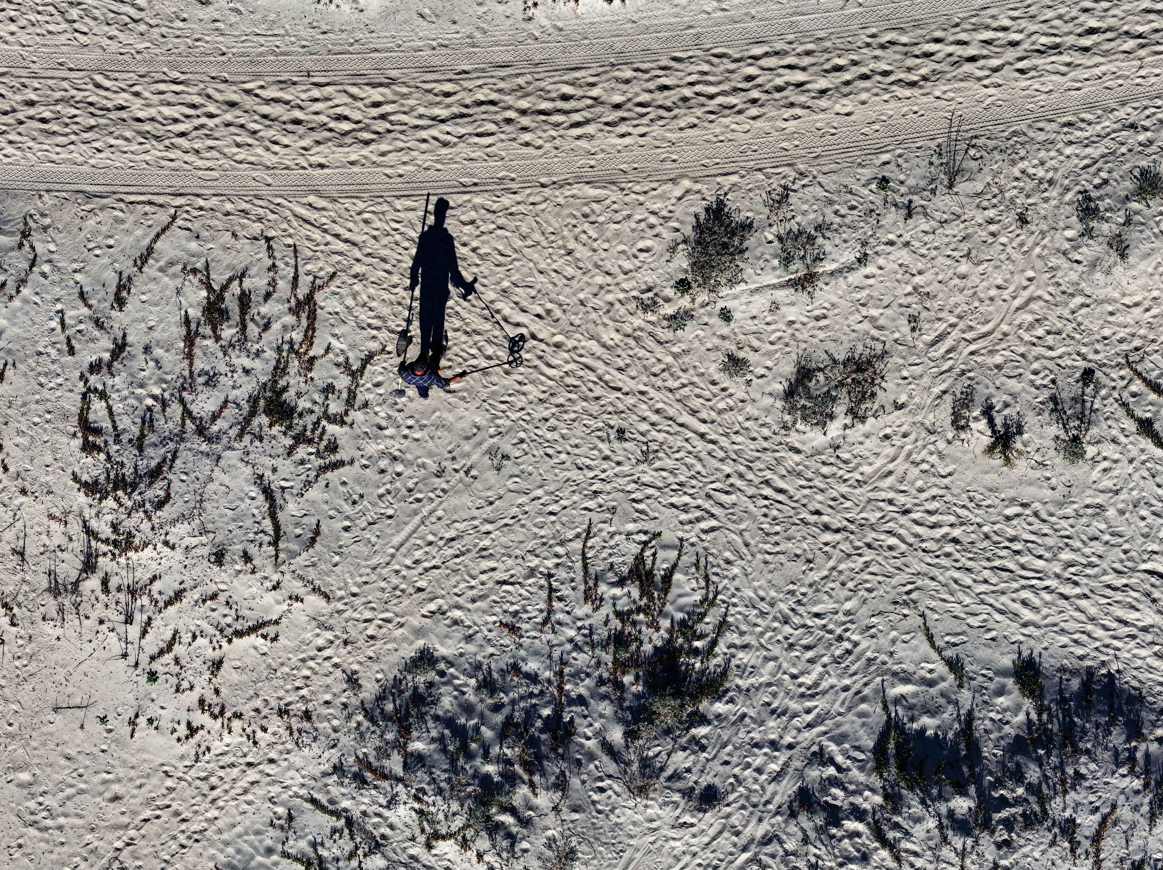 Juan Garcia searches for treasure as he wonders the coastal...