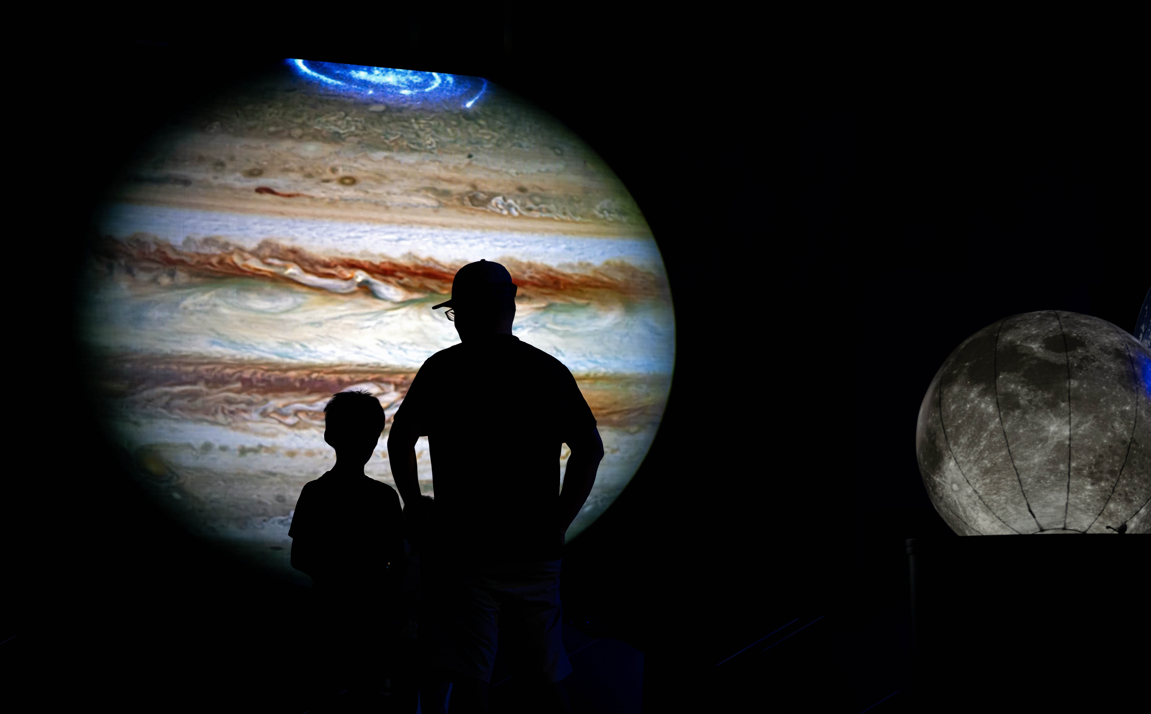 Robert Yee and his son, Nicholas, 8, of Fullerton, watch...