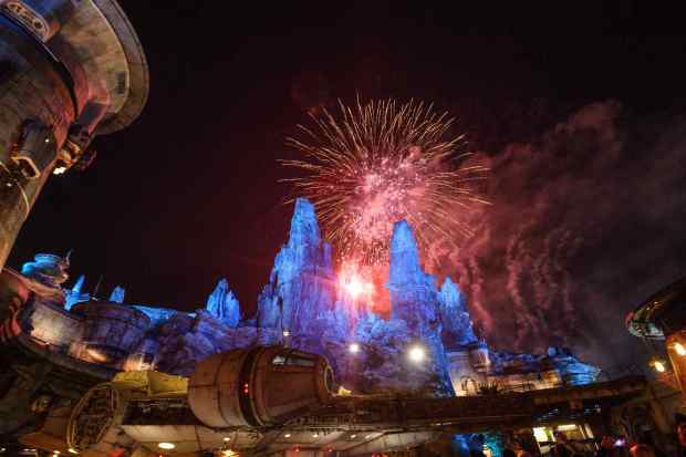 Fireworks explode over the Millennium Falcon at the Black Spire Outpost at Star Wars: Galaxy's Edge inside Disneyland. (Photo by Jeff Gritchen, Orange County Register/SCNG)