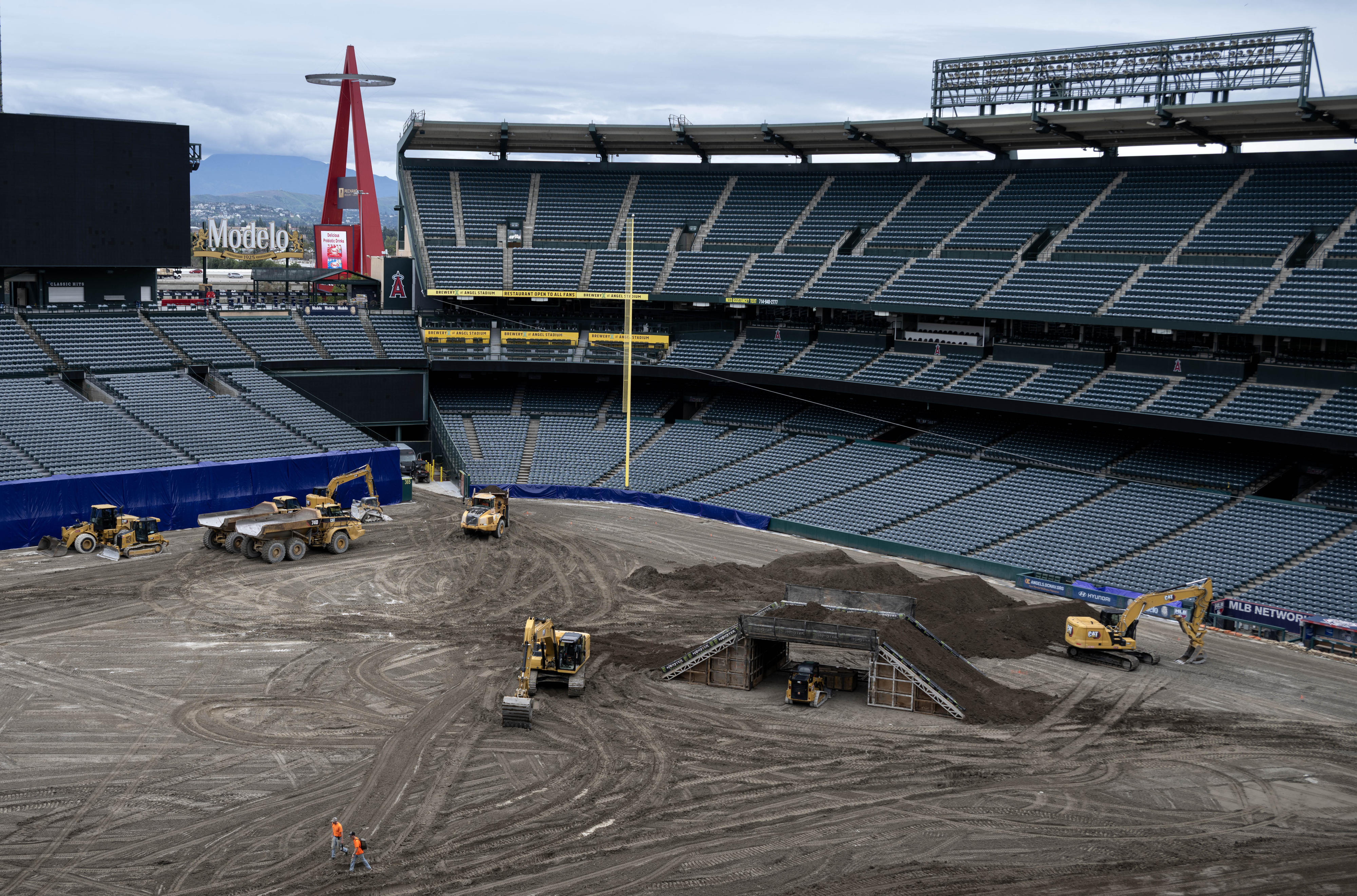 Heavy equipment bustles inside Angels Stadium of Anaheim on Tuesday,...
