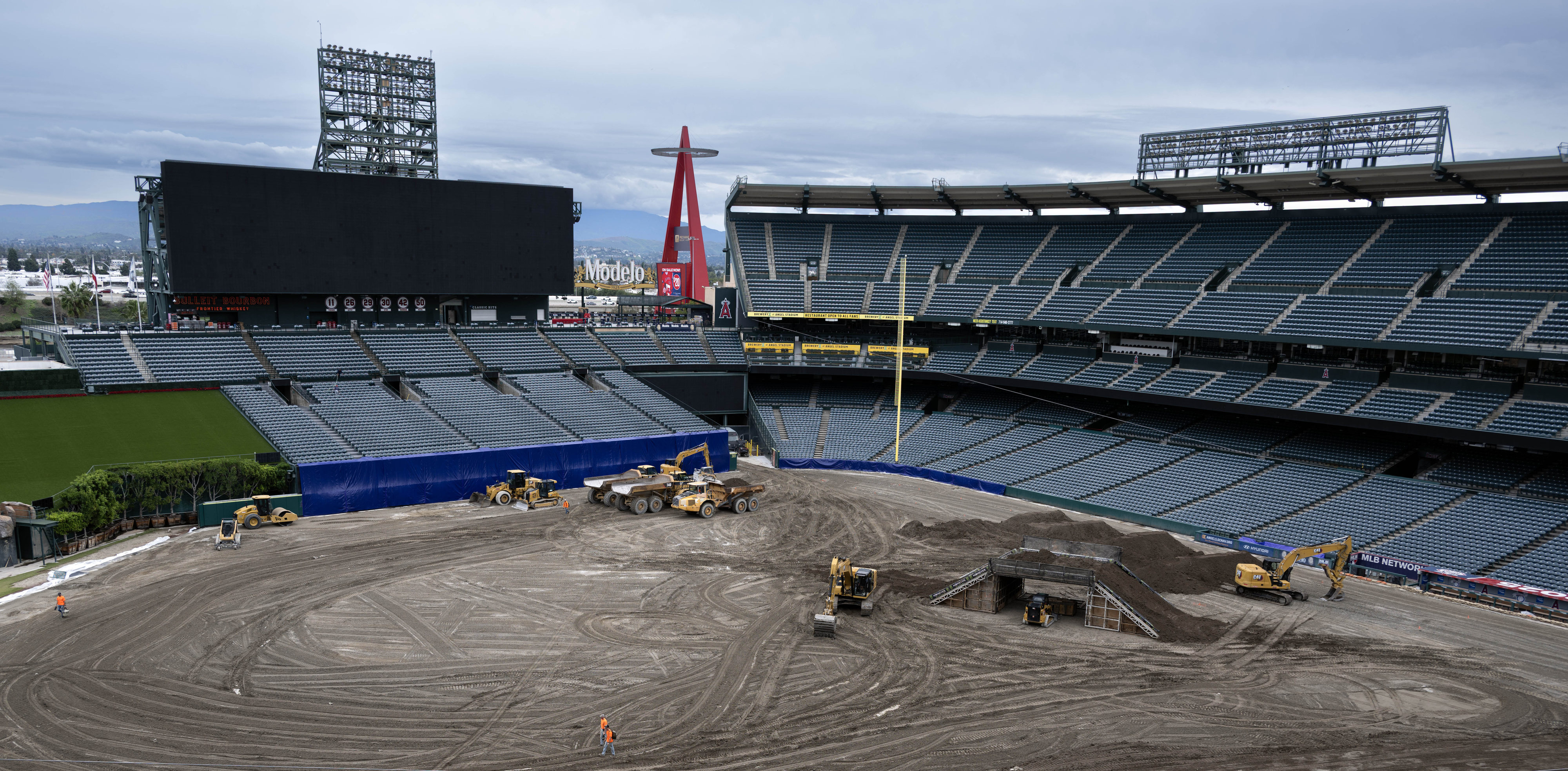 Heavy equipment bustles inside Angels Stadium of Anaheim on Tuesday,...