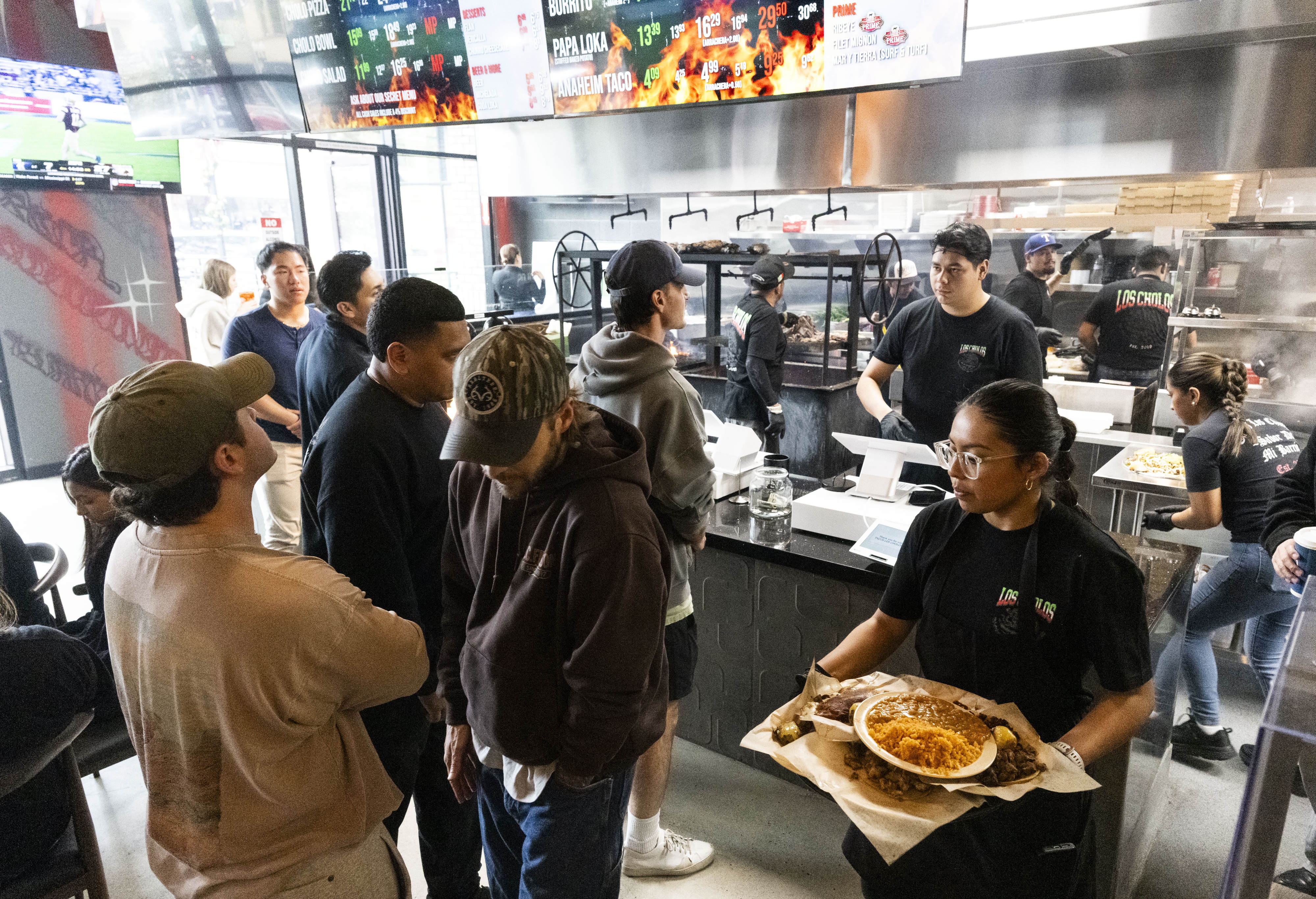 Guests wait to order as food is served to diners...