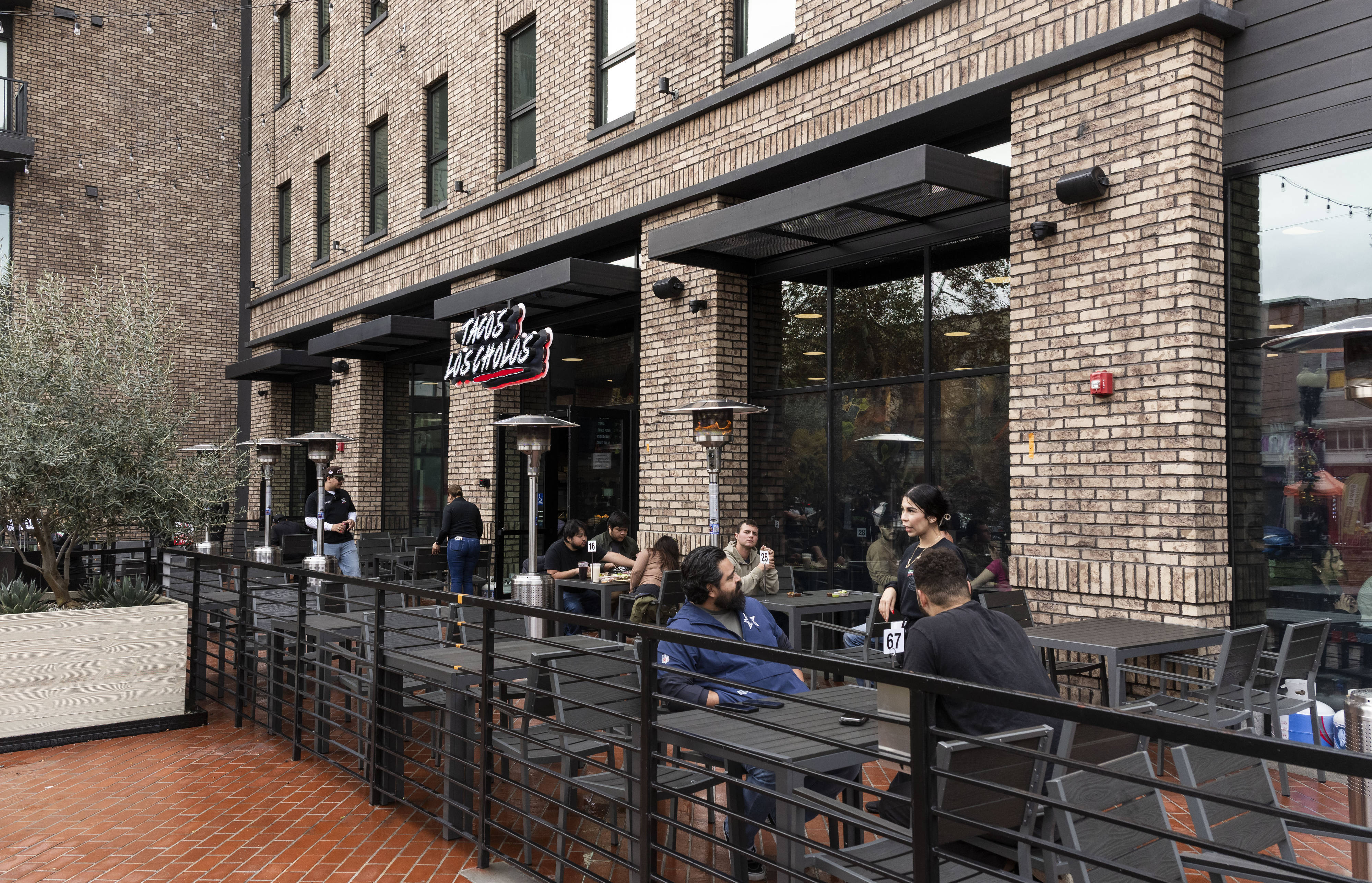 Diners are served on the patio at Tacos Los Cholos...