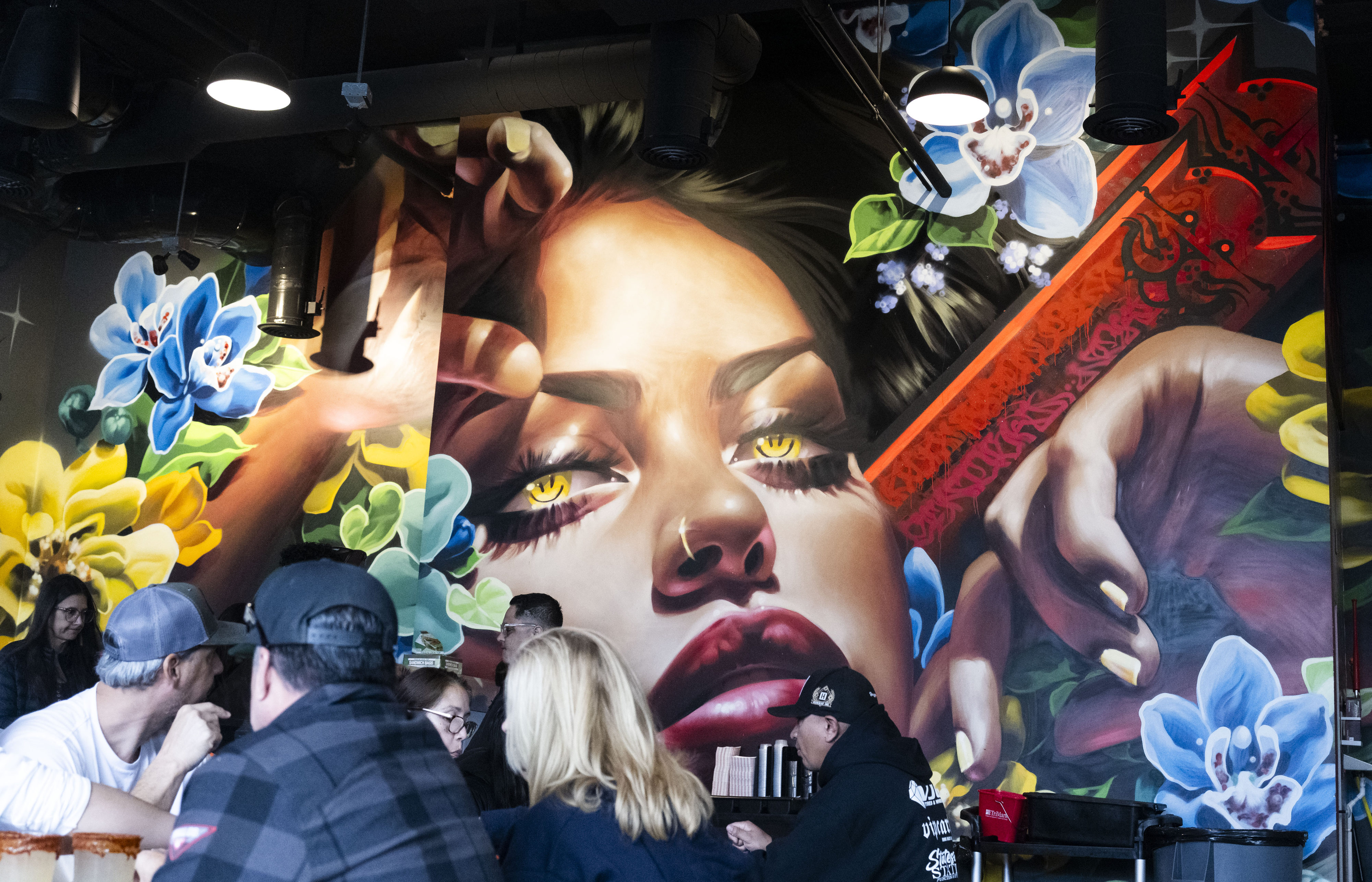 A mural greets diners at Tacos Los Cholos in Santa...