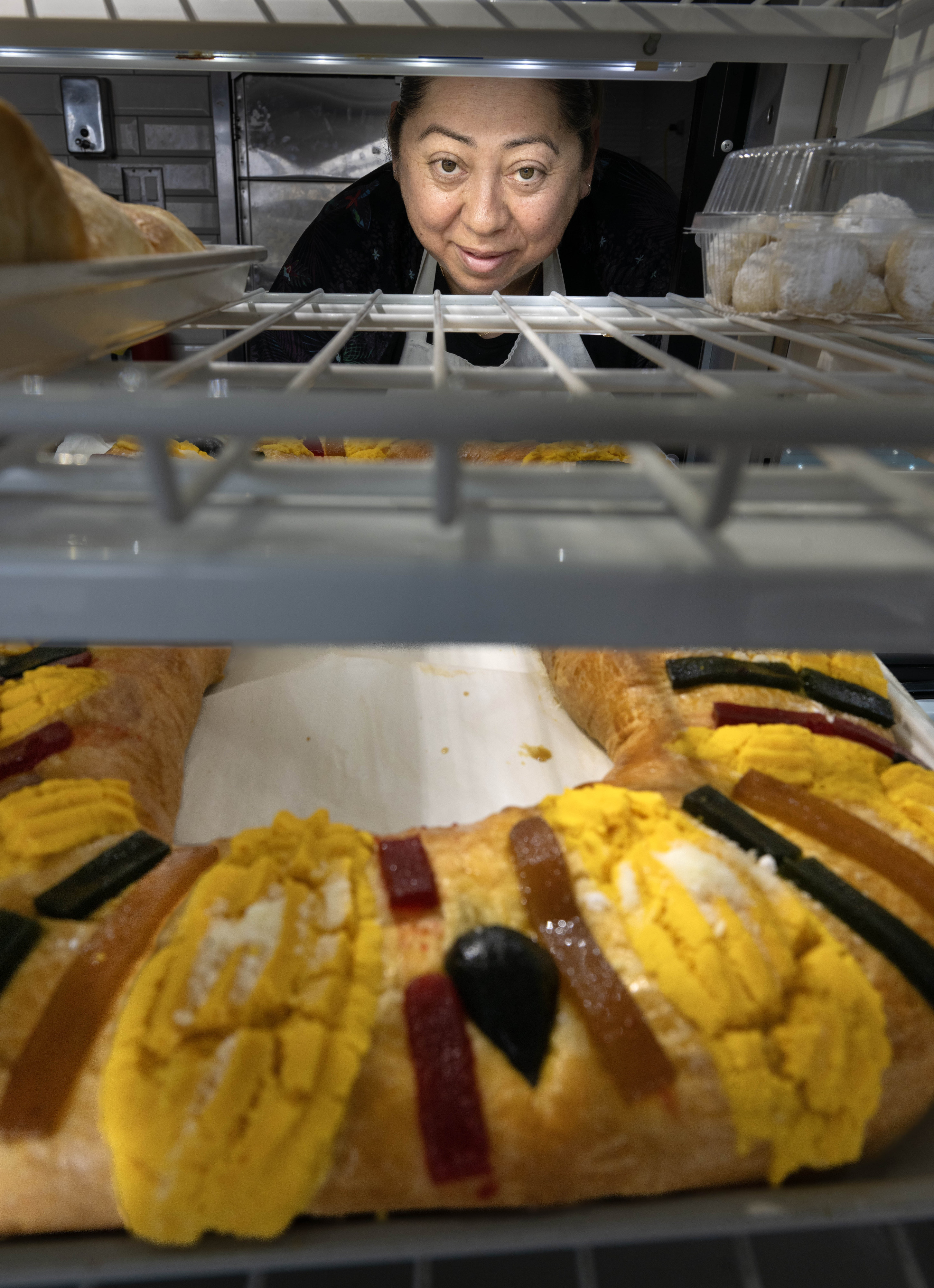 Alma Mendoza, an assistant at Maxâs Bakery in Anaheim, looks...