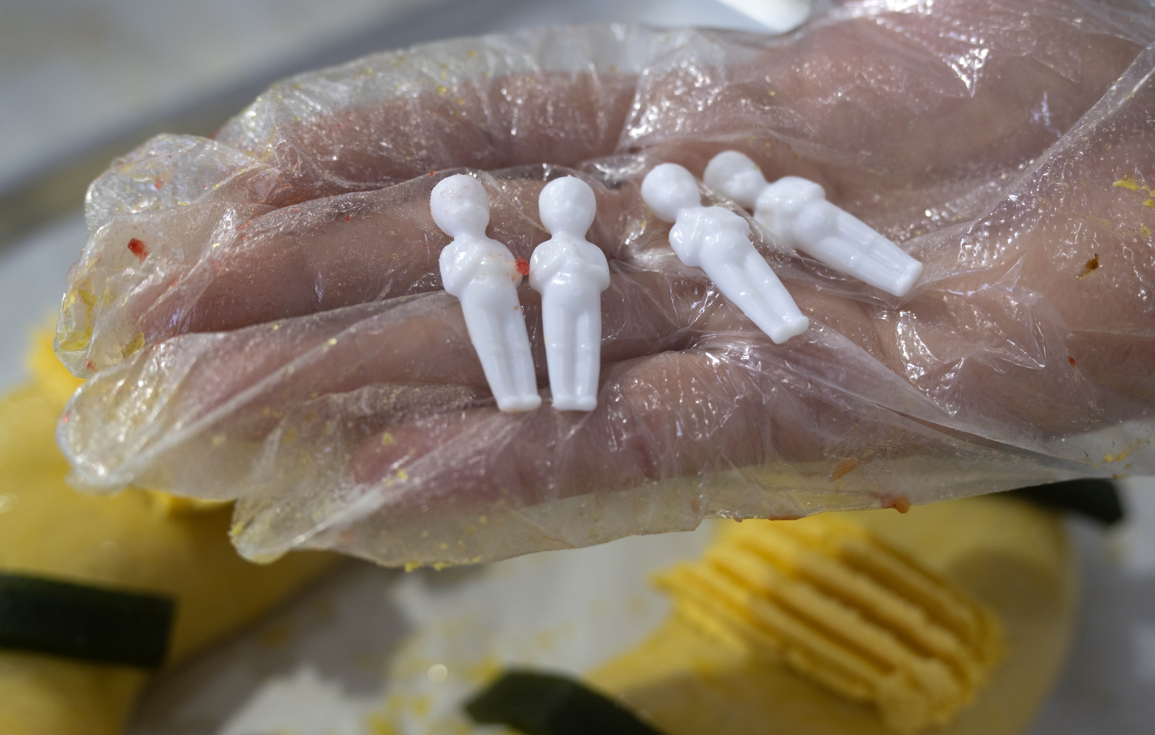 Carmen Mendoza with Max’s Bakery in Anaheim, shows small figurines...