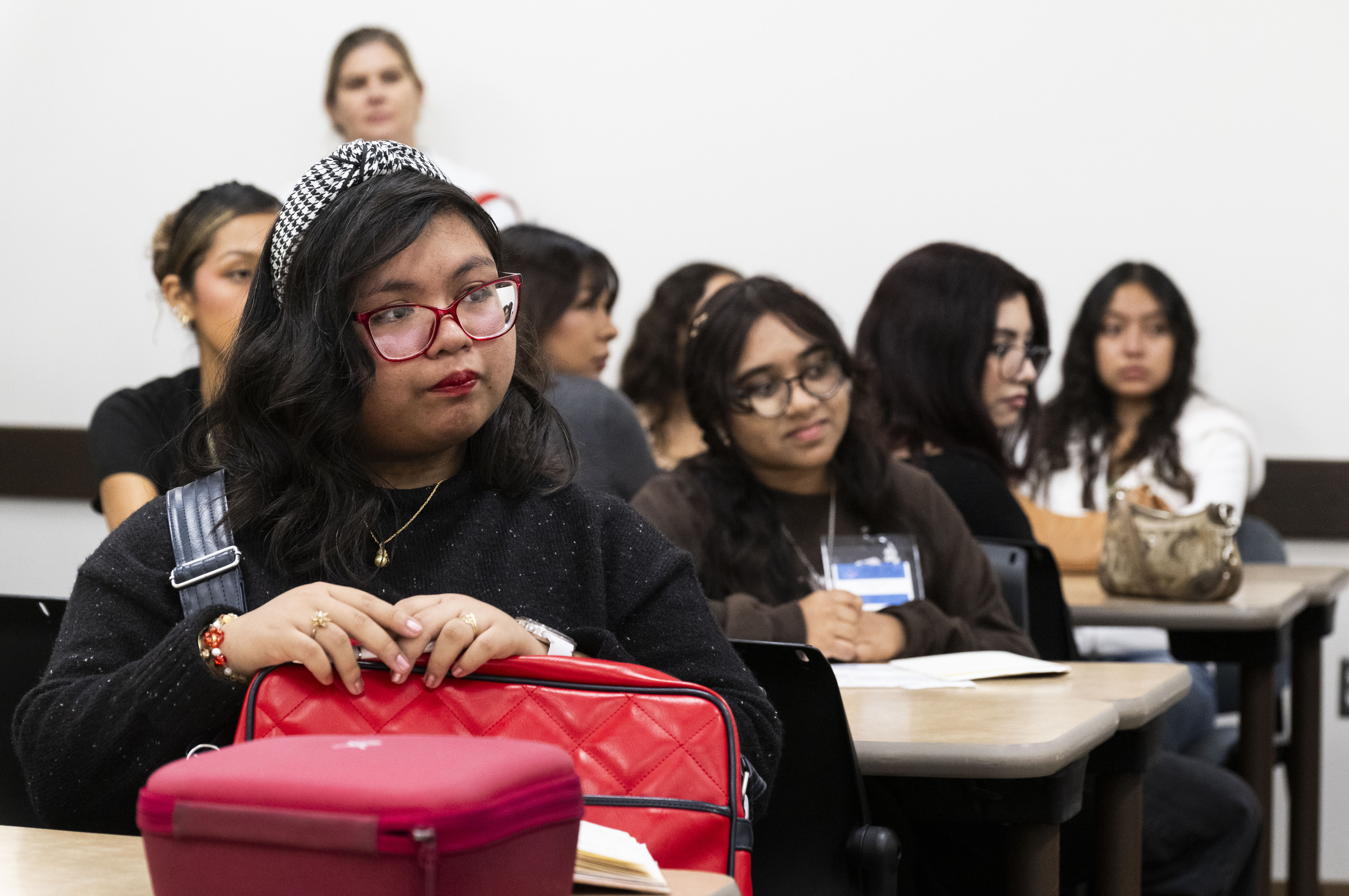 Students listen to a panel discussion from people in the...