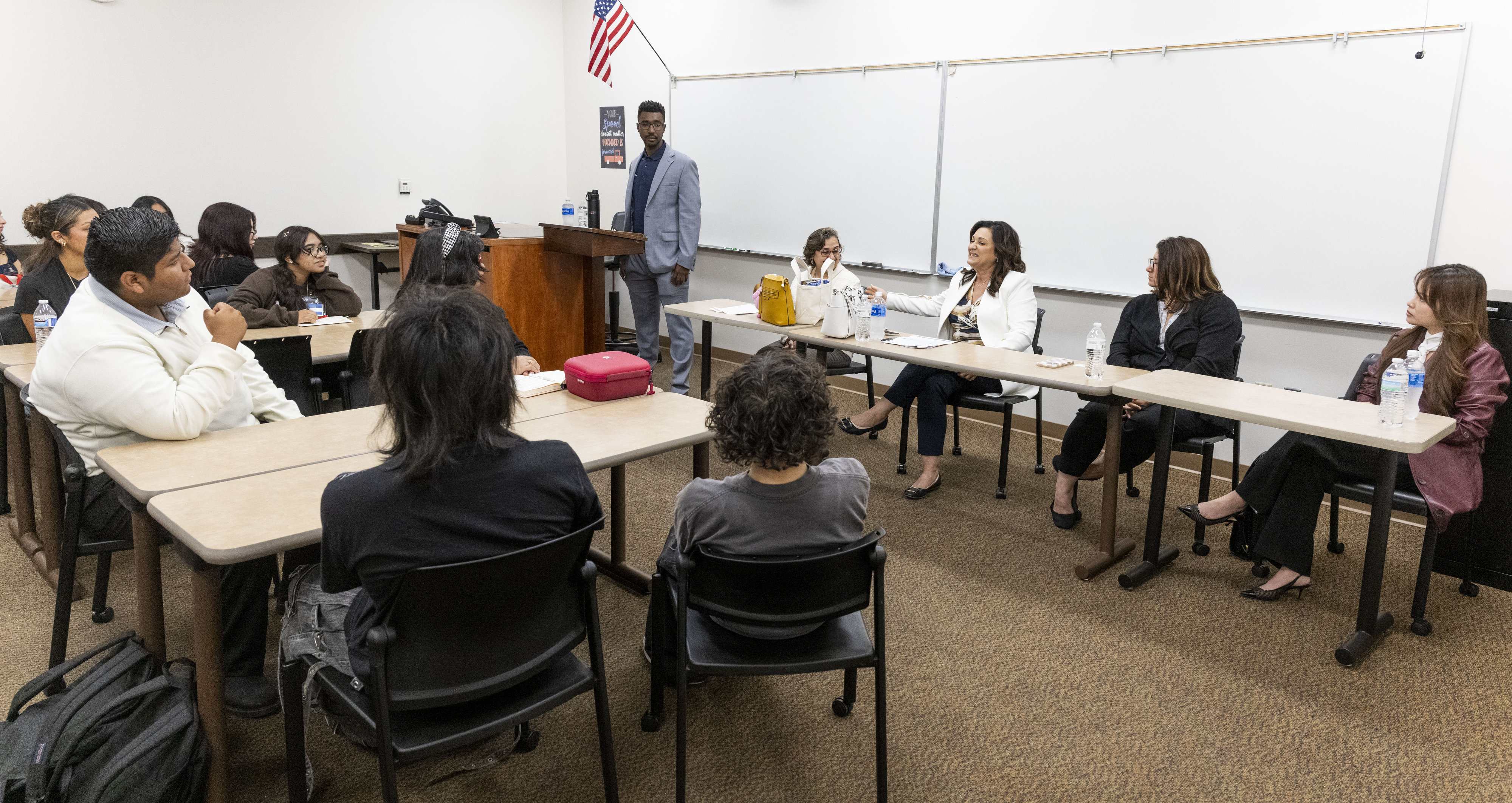 Students listen to a panel discussion with members of the...