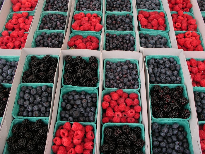 Boxes of blackberries, strawberries, blueberries, and raspberries