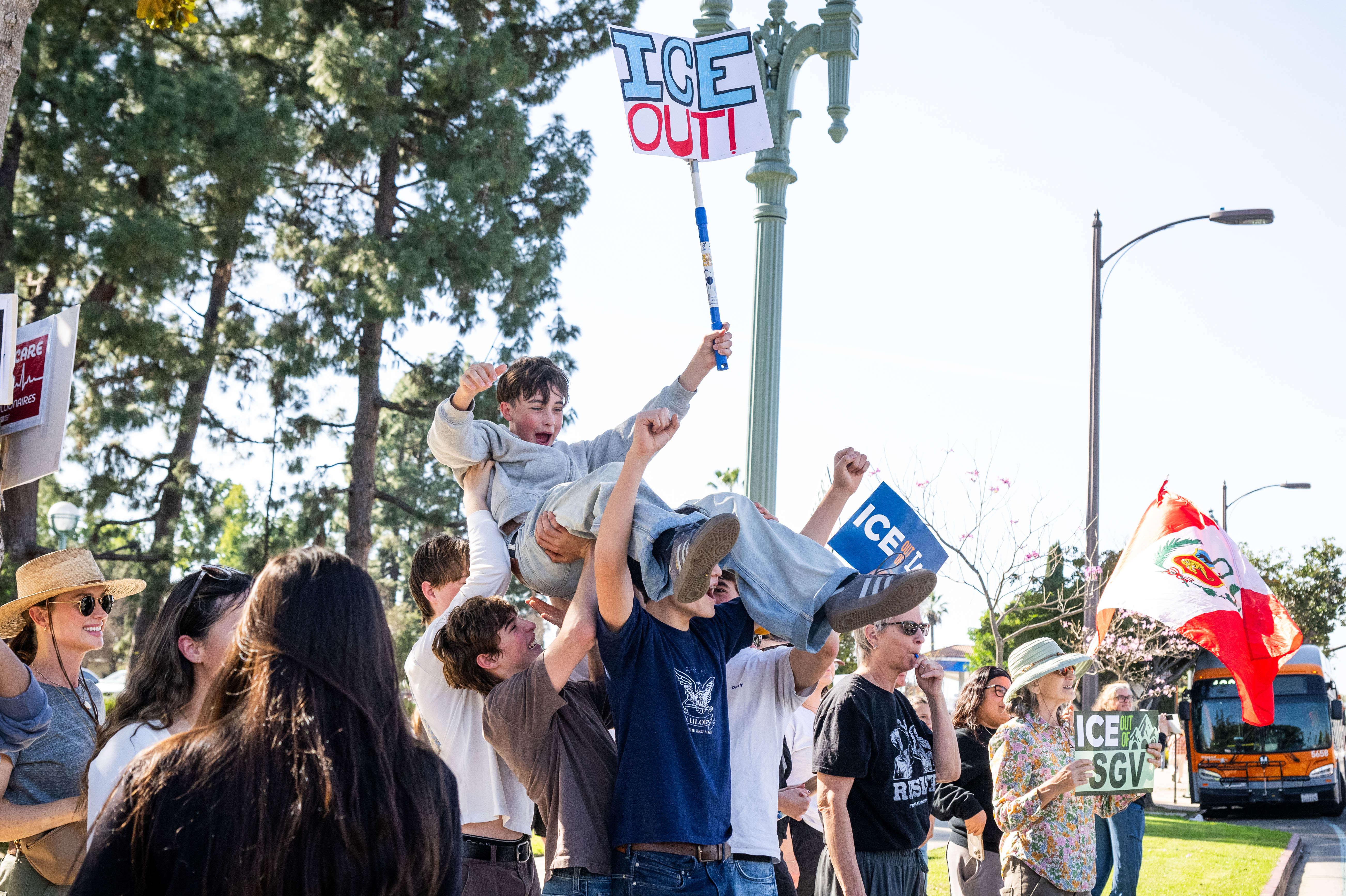 Marshall High School students lift Leif Schmidt, 14, of Irving...