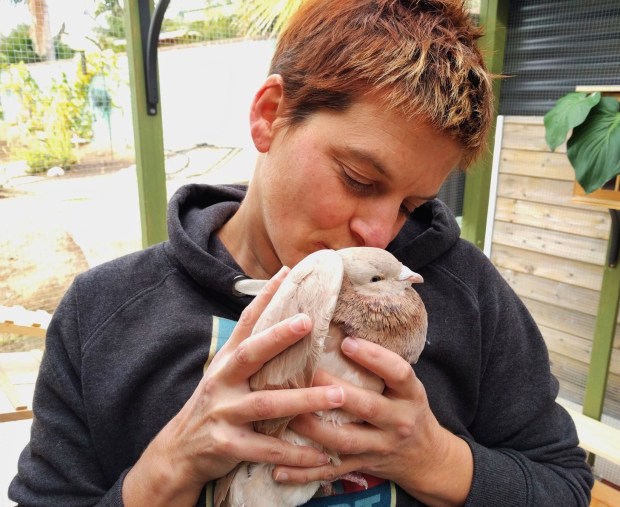 Moose's Flock bird sanctuary founder Jenna Close cuddles with the nonprofit's namesake, Moose. (Courtesy Jenna Close)