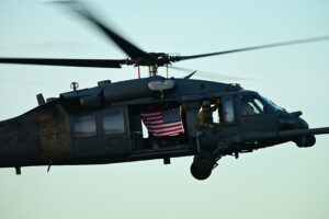 A photo of a CalGuard helicopter with an American flag.