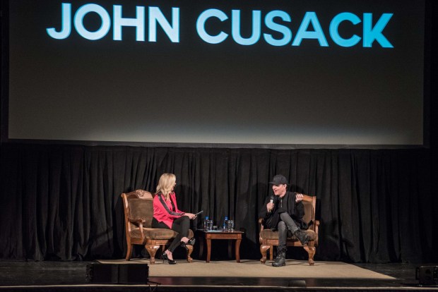 Moderator and Wisconsin morning TV show host Tiffany Ogle chats with John Cusack at a screening of his 1989 romantic comedy "Say Anything." (Daniel Ojeda, courtesy of The Backlog Project)