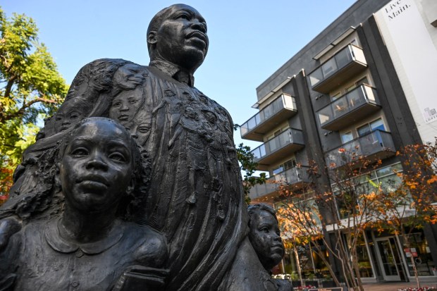 A statue of the Rev. Martin Luther King Jr. is seen Tuesday, Jan. 13, 2026, in downtown Riverside. The sculpture, created in 1999 by artist Lisa Reinertson, features children alongside King in reference to his "I Have a Dream" speech. (Photo by Anjali Sharif-Paul, The Sun/SCNG)