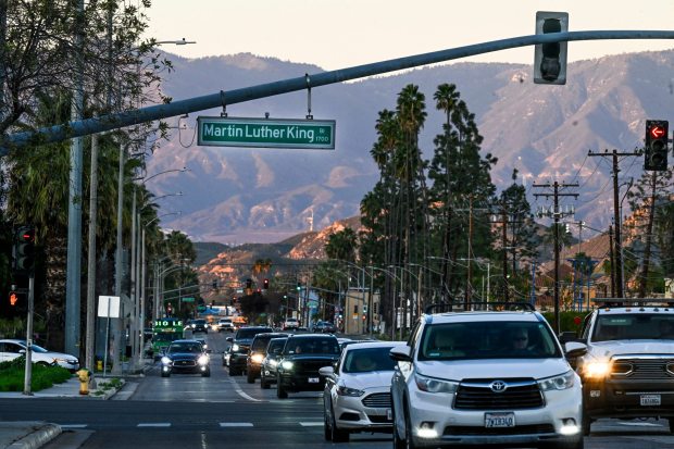 A street sign on Martin Luther King Boulevard in Riverside's Eastside neighborhood is seen Tuesday, Jan. 13, 2026, as traffic moves by. (Photo by Anjali Sharif-Paul, The Sun/SCNG)