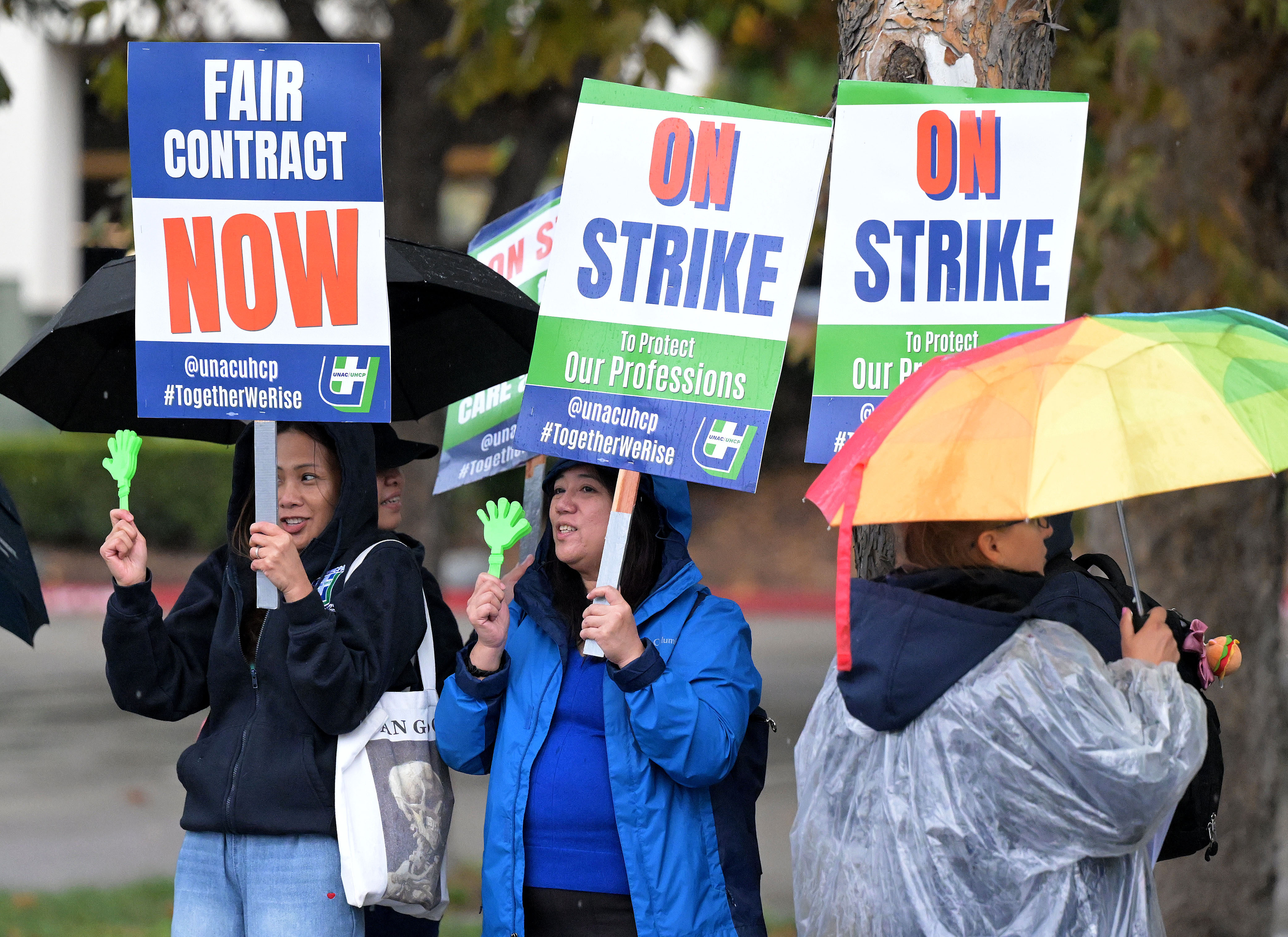 Some of the approximately 300 Kaiser employees in attendance strike...