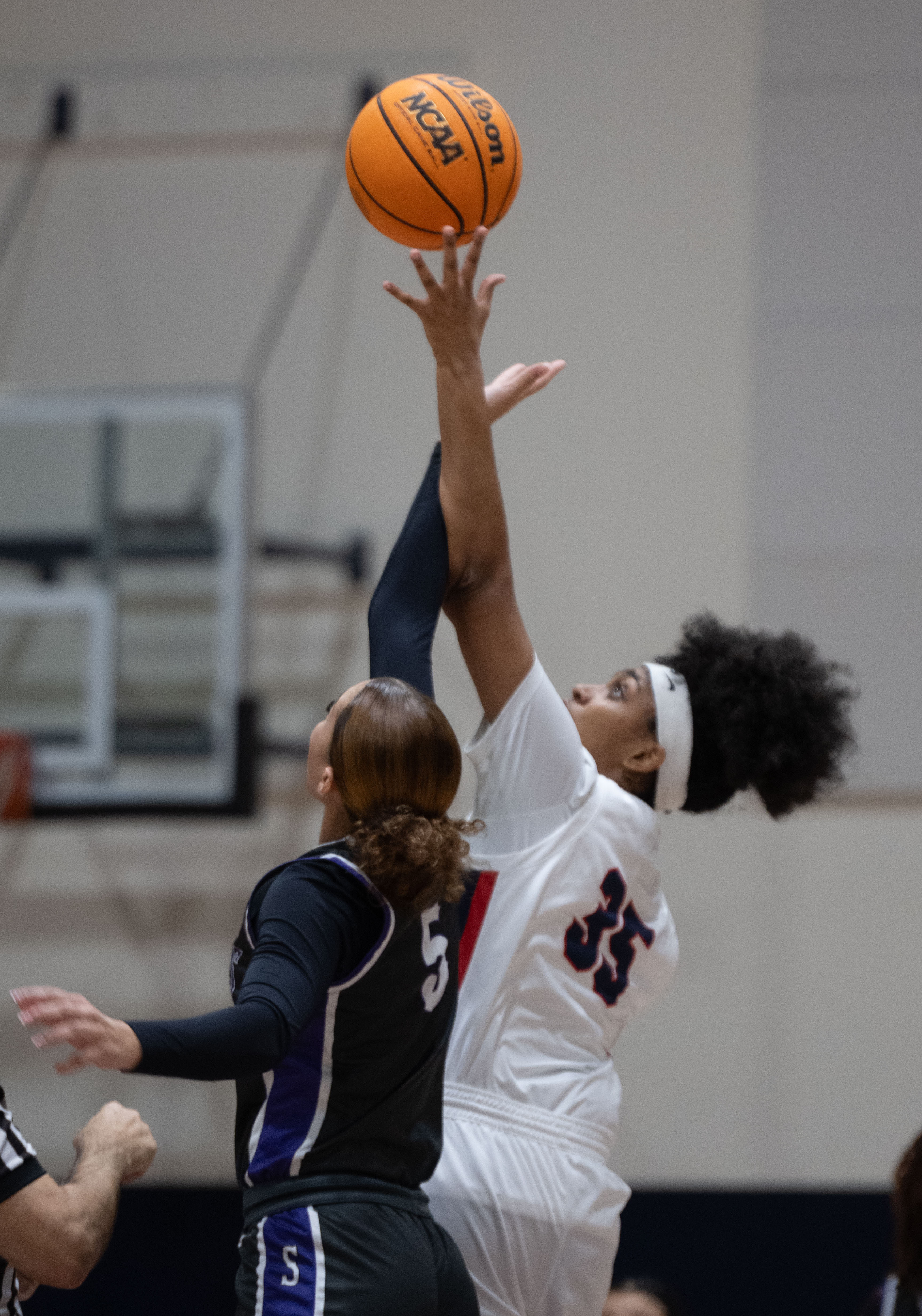 St. Anthony’s Dallyn Knox and La Salle’s Riley Higgins jump...