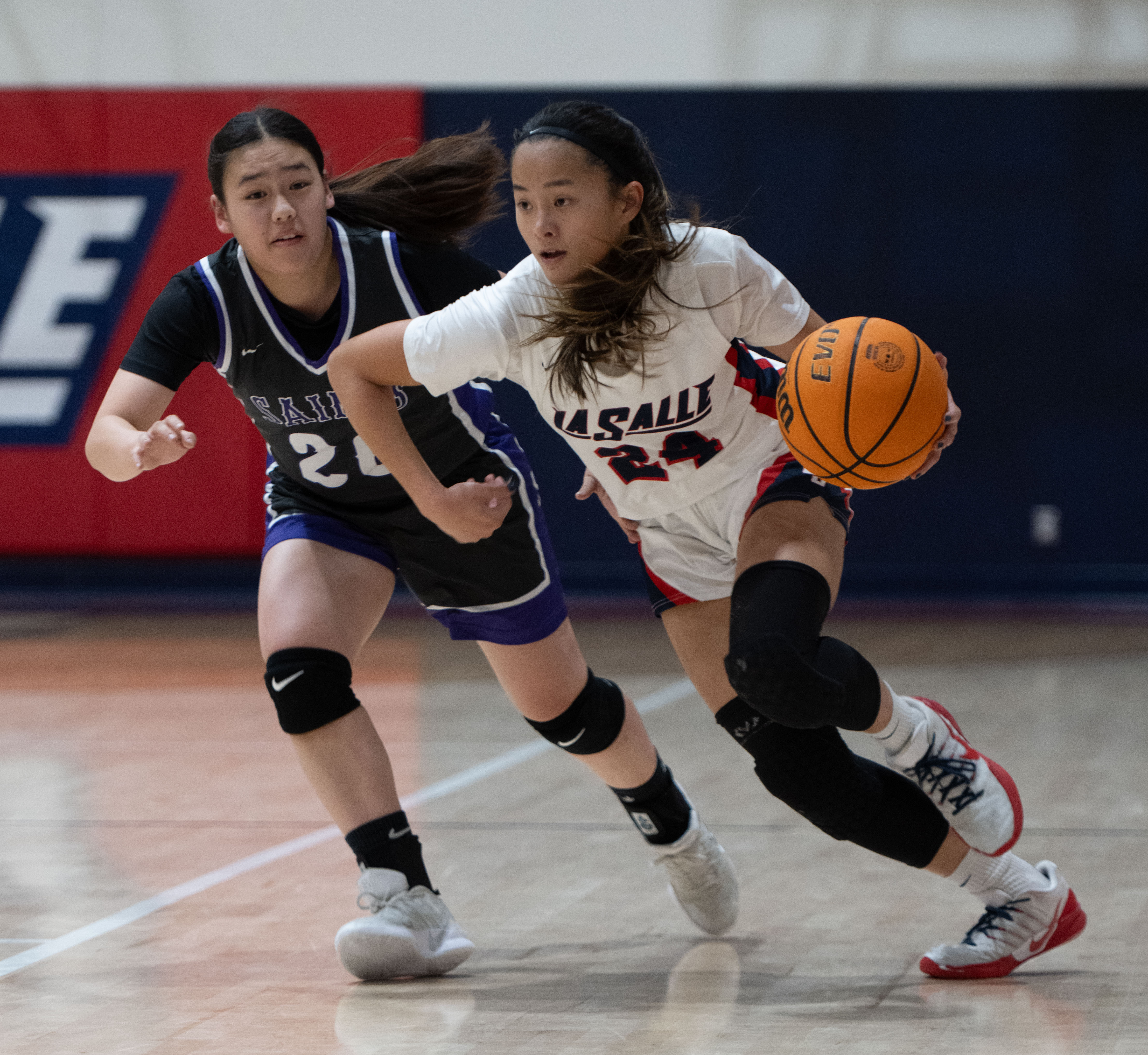 La Salle’s Emily Fong takes the ball around St. Anthony’s...