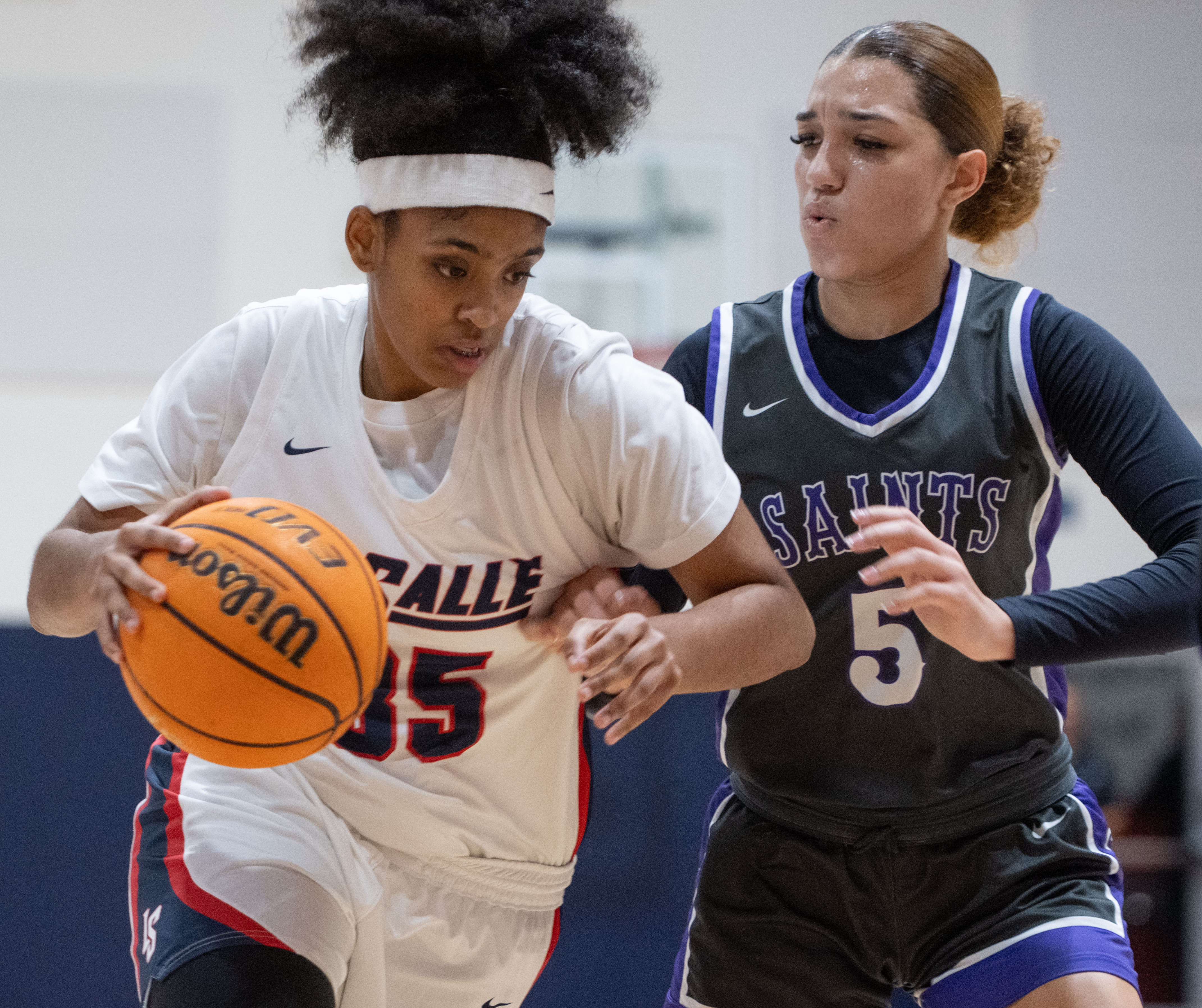 La Salle’s Riley Higgins makes her way past St. Anthony’s...