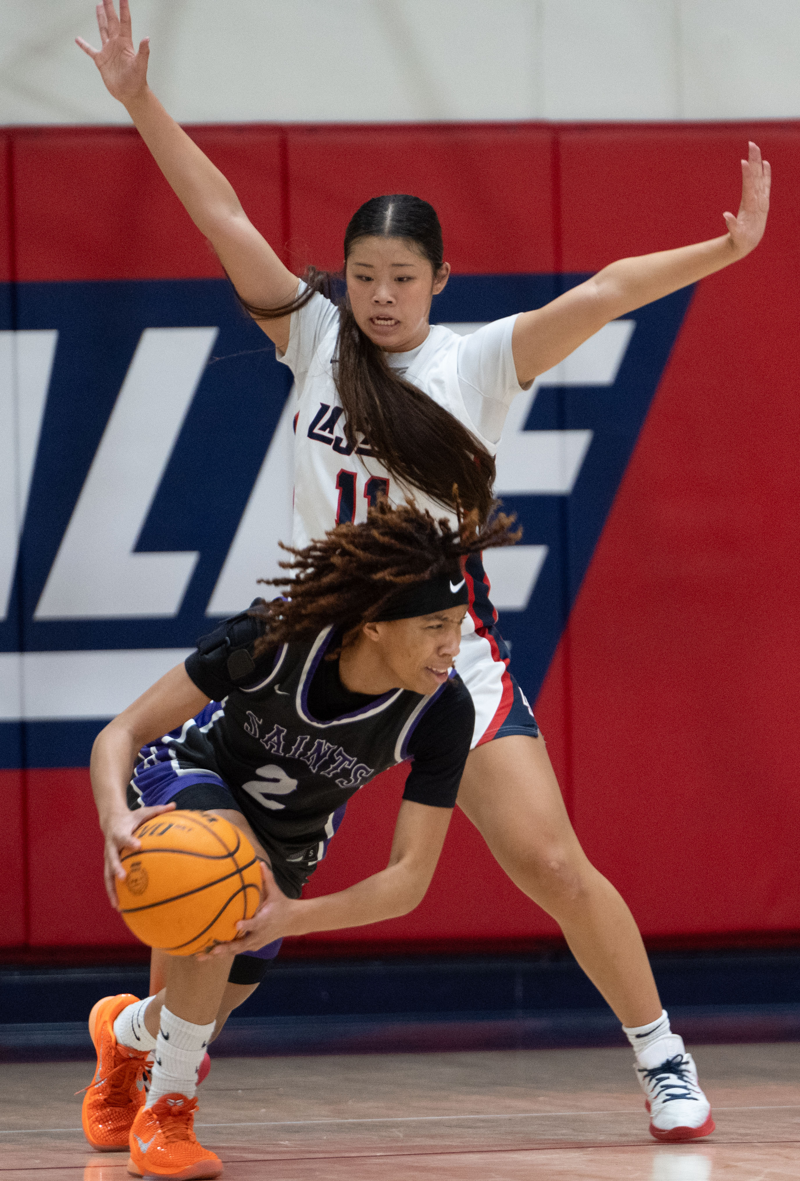 St. Anthony’s Laila Hughes is pressured by La Salle’s Julianne...
