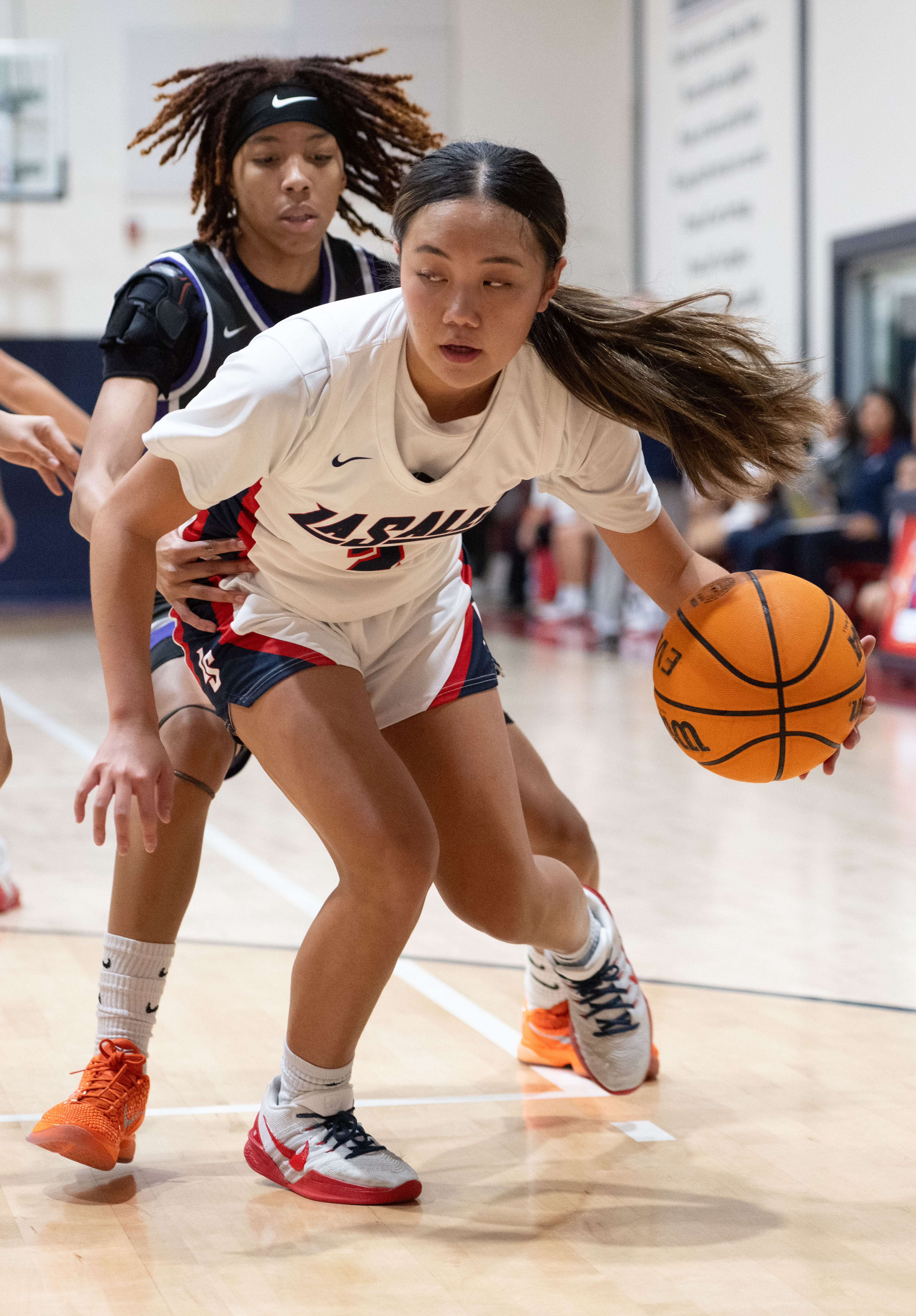 La Salle’s Maddy Chiang is guarded by St. Anthony’s Laila...