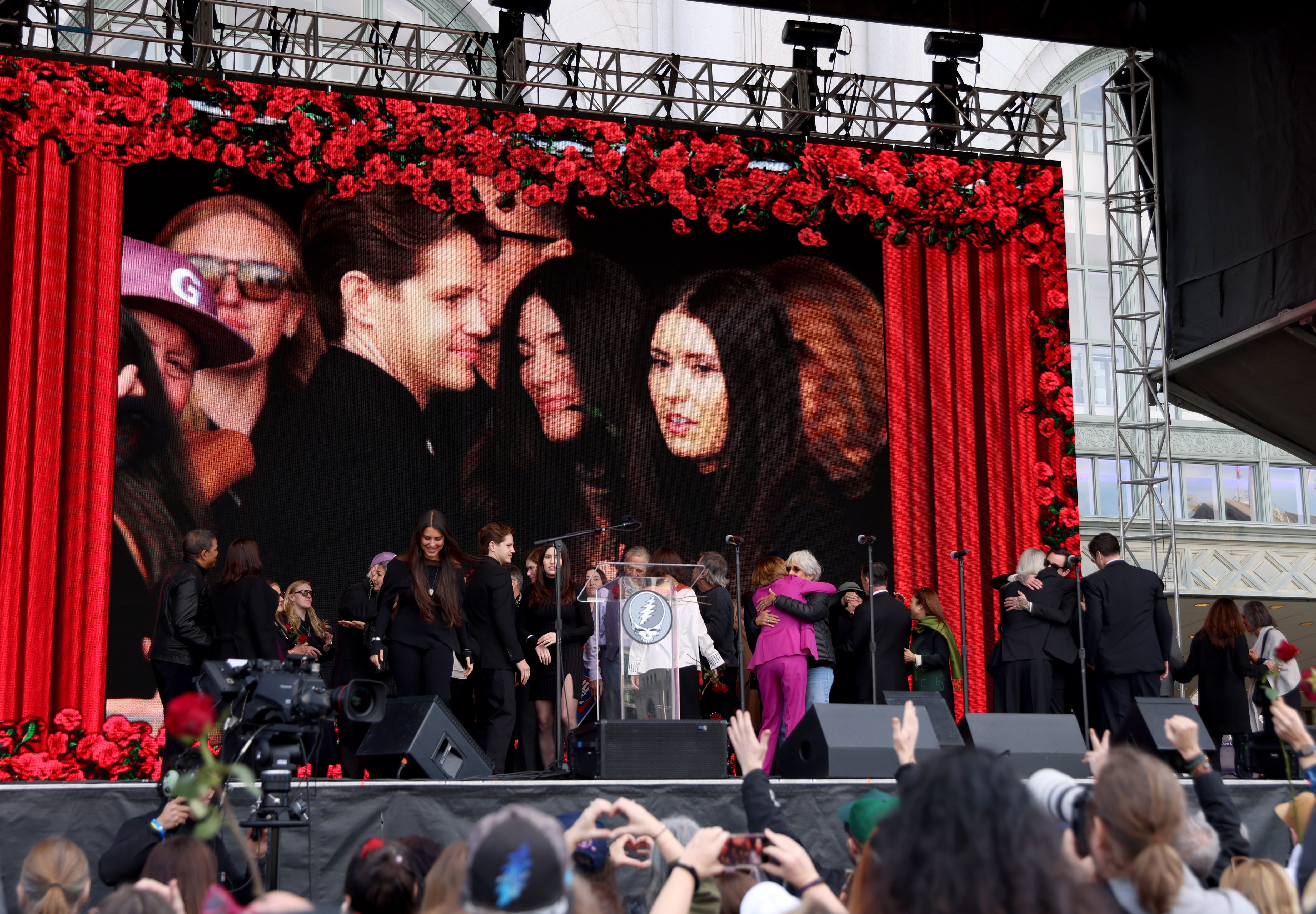 Musician and activist Joan Baez, right center, and former Speaker...