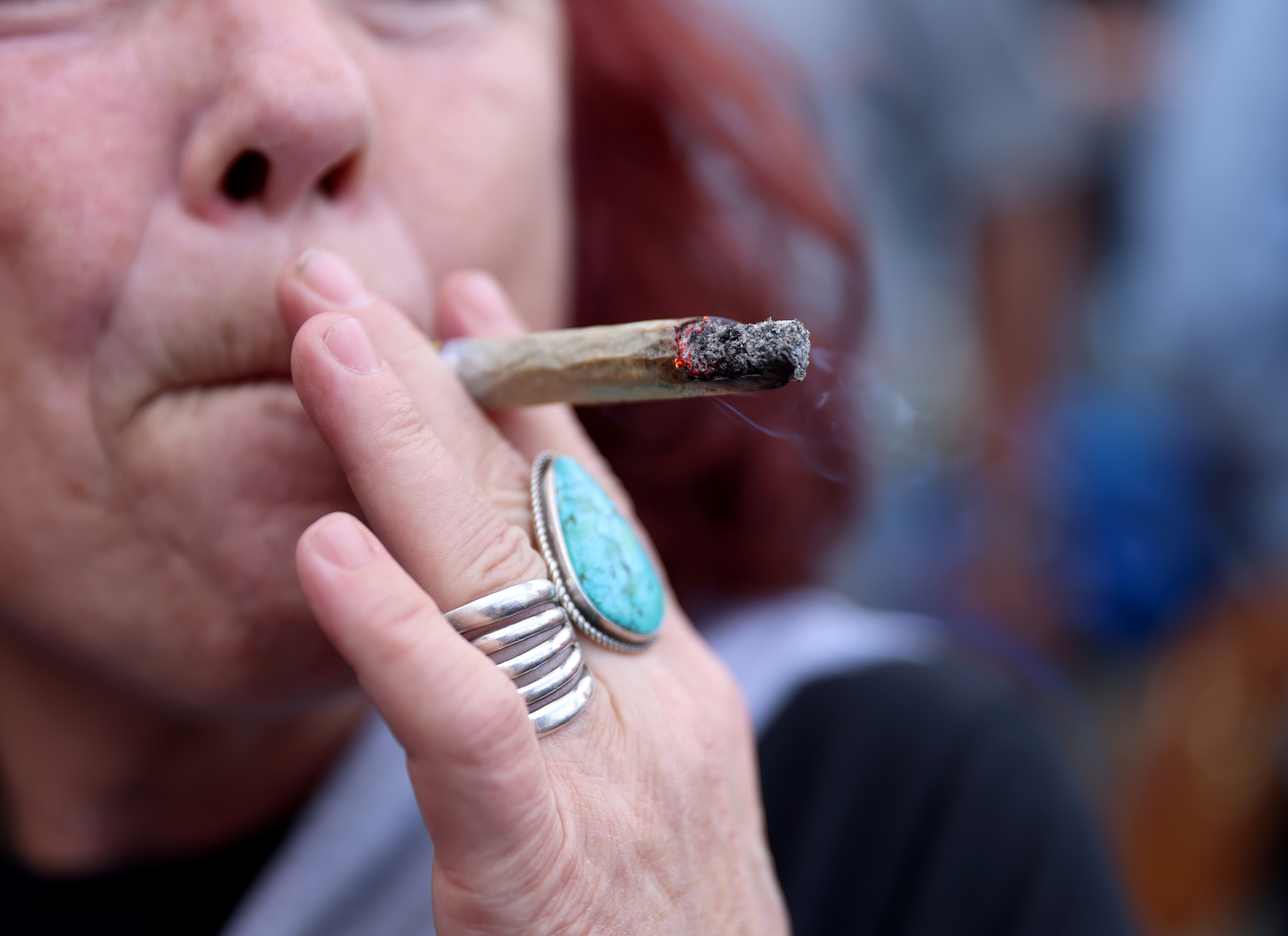 A Grateful Dead fans smokes a joint at the Bob...