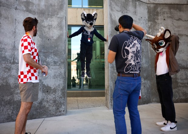 Derix, from Calgary, Canada, who preferred to give their character name only, poses for a photograph at Further Confusion, also known as FurCon, outside of the San Jose McEnery Convention Center in downtown San Jose, Calif., on Sunday, Jan. 18, 2026. (Nhat V. Meyer/Bay Area News Group)