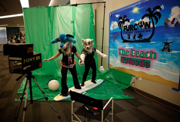Razer, left, and Quince, both from Bakersfield, who preferred to give their character names only, pose for a photo in the photo booth at Further Confusion, also known as FurCon, at the San Jose McEnery Convention Center in downtown San Jose, Calif., on Sunday, Jan. 18, 2026. FurCon had a beach theme this year called "The Beach Episode." (Nhat V. Meyer/Bay Area News Group)
